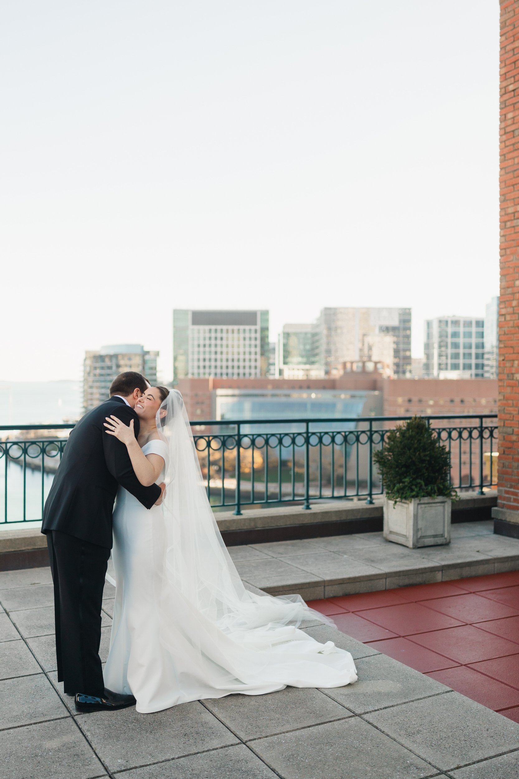 Bride and groom seeing each other for the first time on the Boston Harbor Hotel rooftop