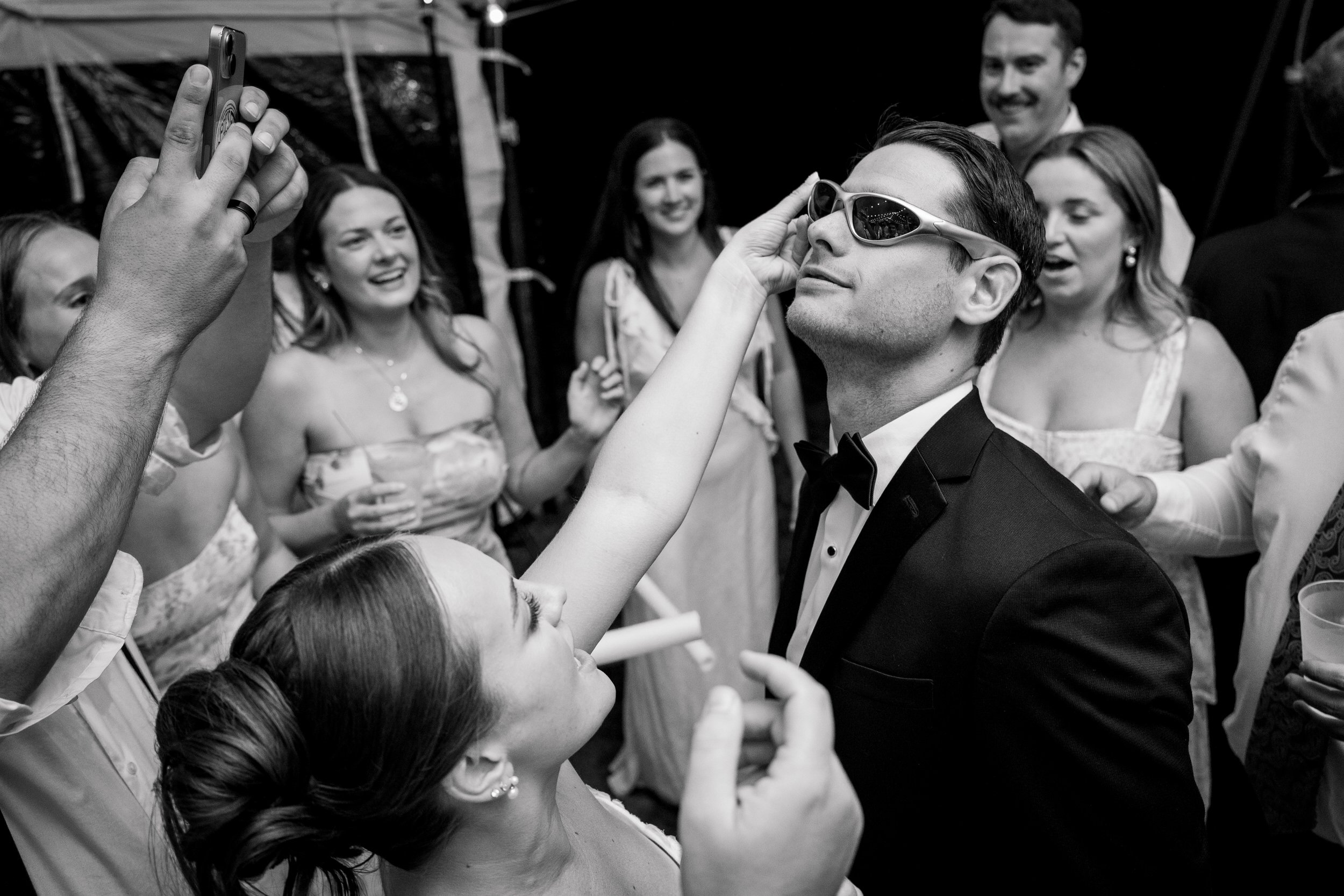 Wedding guests dancing under a tent at a Cape Cod estate.