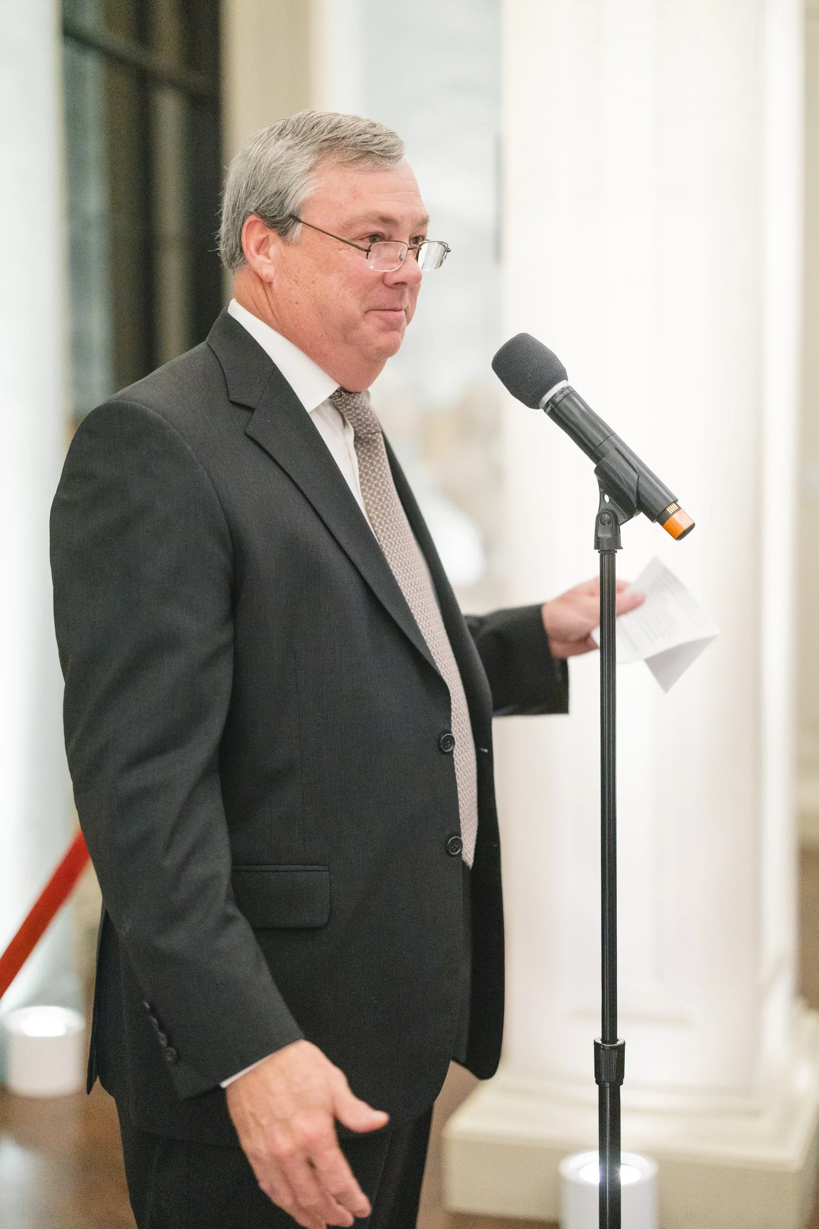 Emotional speech during a candlelit rehearsal dinner at the Boston Athenaeum