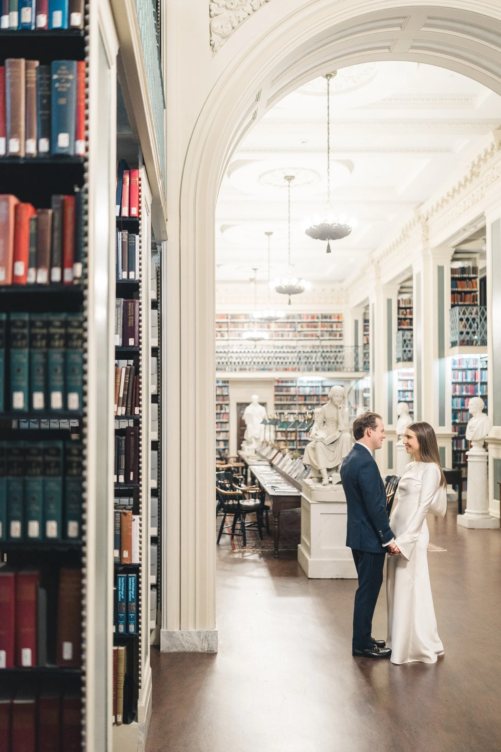 Editorial-style couple portrait in the reading room at the Boston Athenaeum
