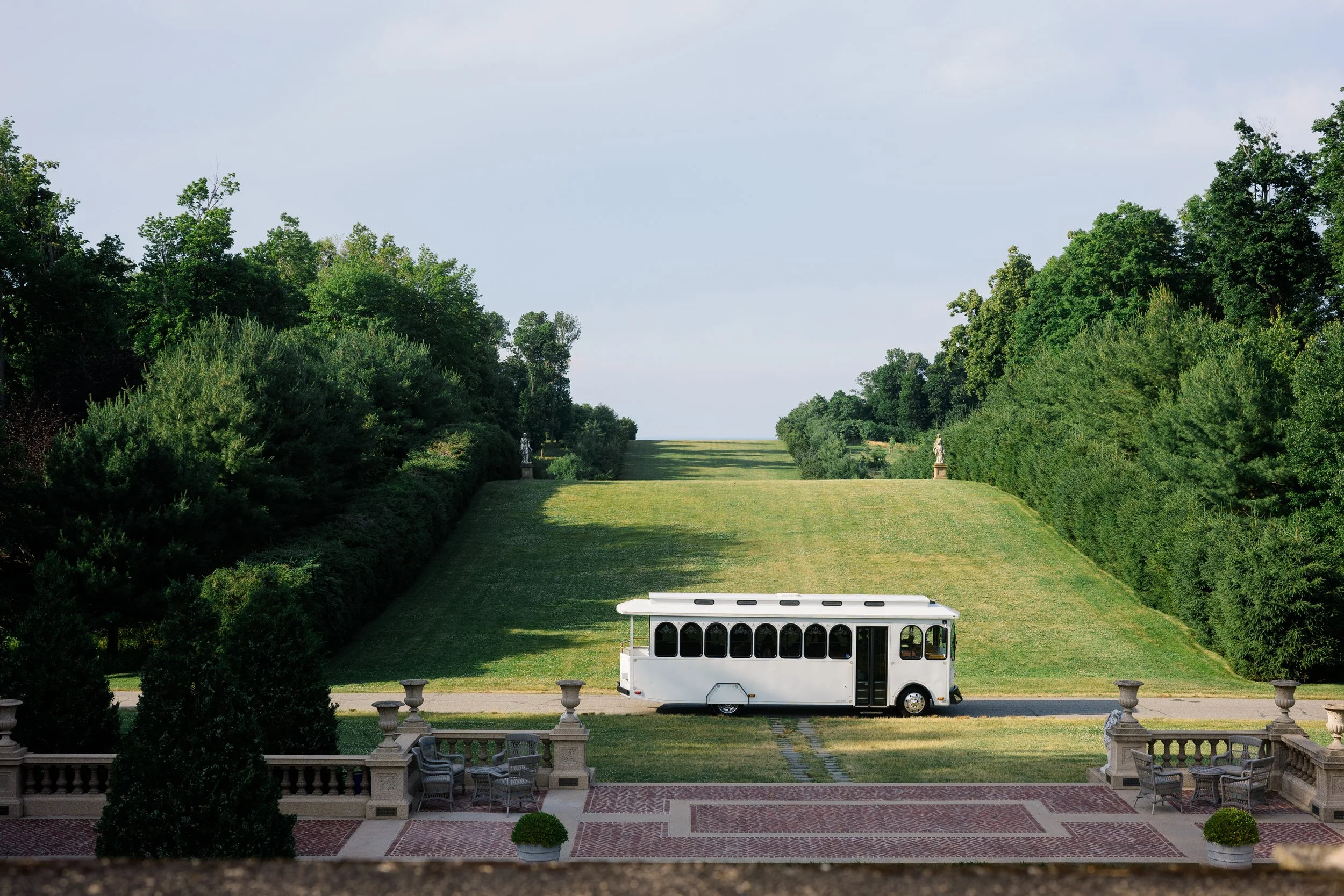 Bride and groom arriving separately at Castle Hill on the Crane Estate in Ipswich, Massachusetts for their wedding day.