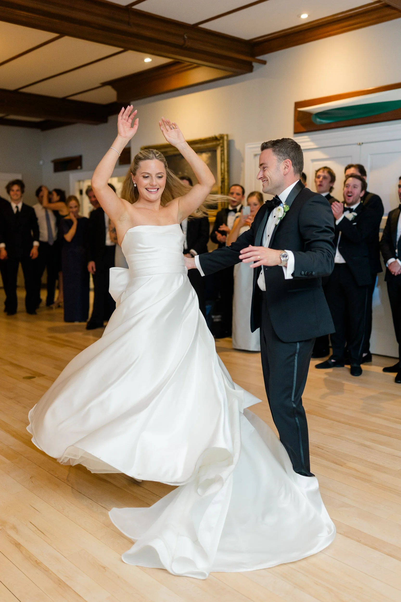 Wedding reception at Corinthian Yacht Club overlooking Marblehead Harbor with dancing and celebration.