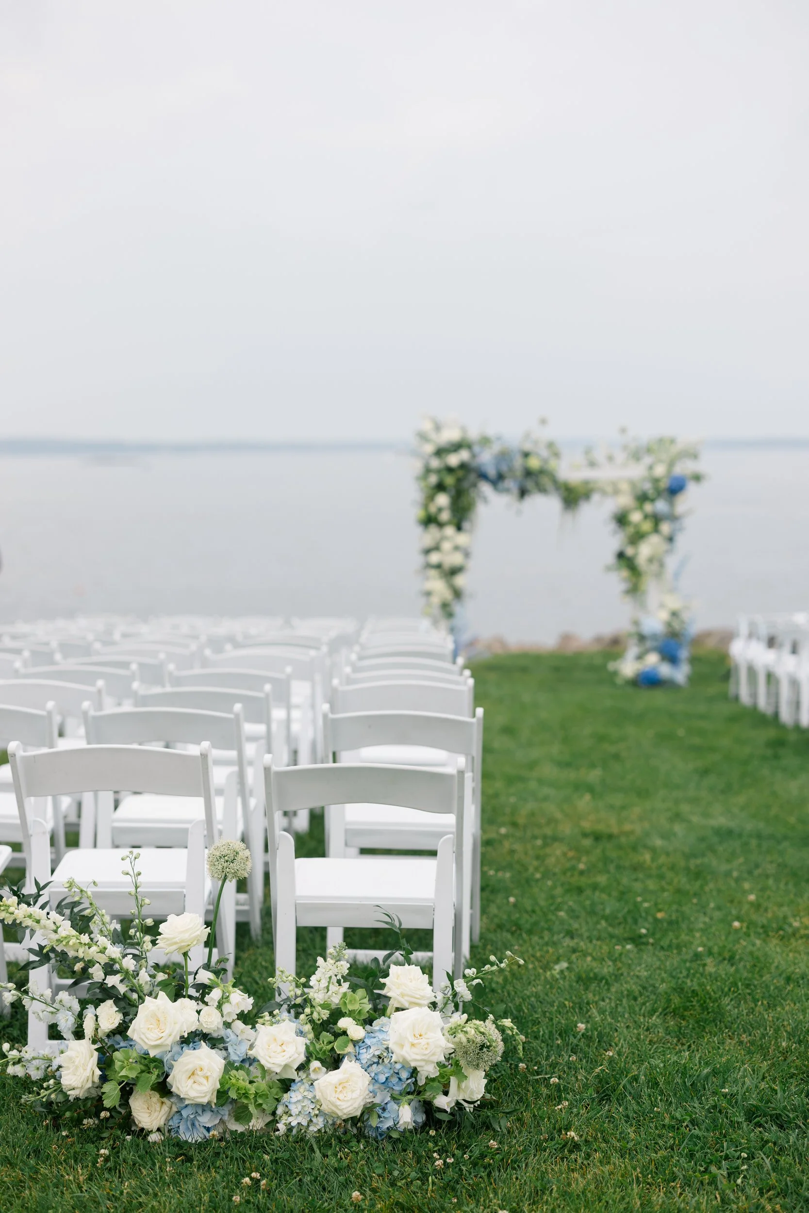 Ceremony details from a Corinthian Yacht Club Marblehead wedding featuring a modern chuppah overlooking Marblehead Harbor.