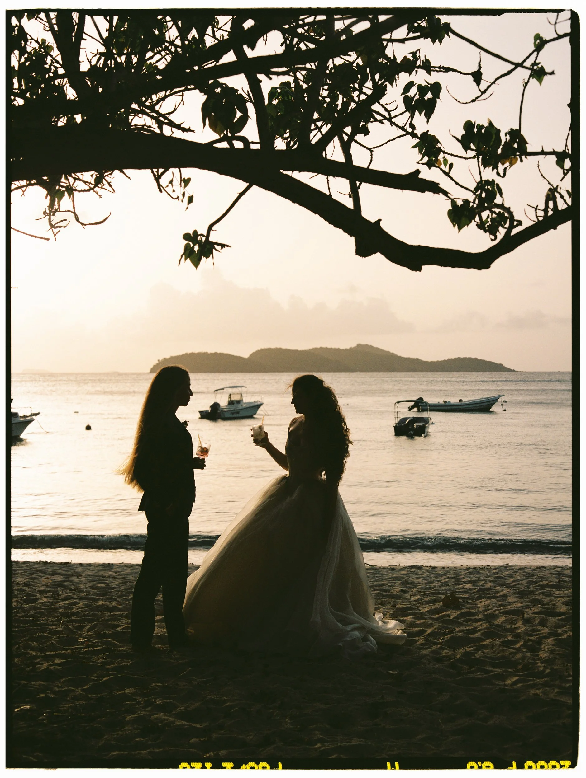 Film wedding photography capturing a Caribbean sunset portrait.