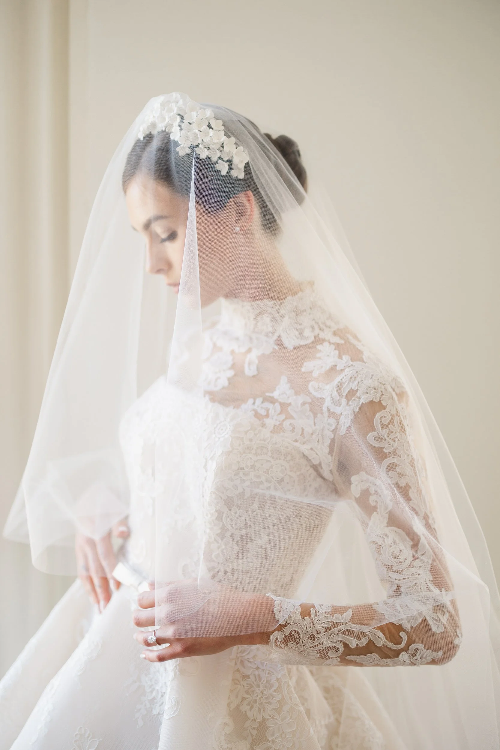 Elegant neutral bridal portrait in the architectural interior of Brasserie La Banque, Charleston SC, captured in a timeless, editorial style