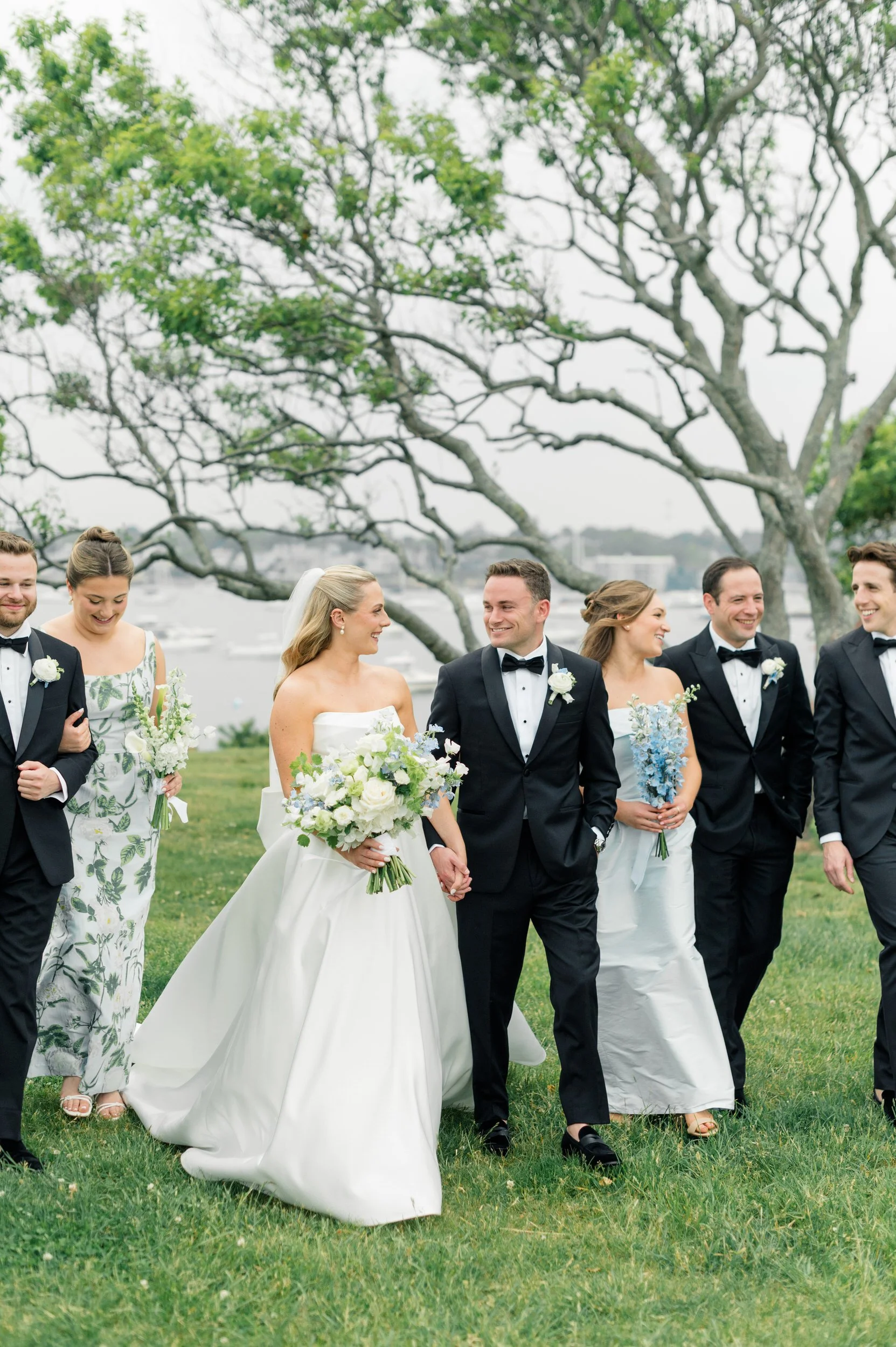 Bridesmaids and groomsmen gathered at a coastal New England wedding on the North Shore.