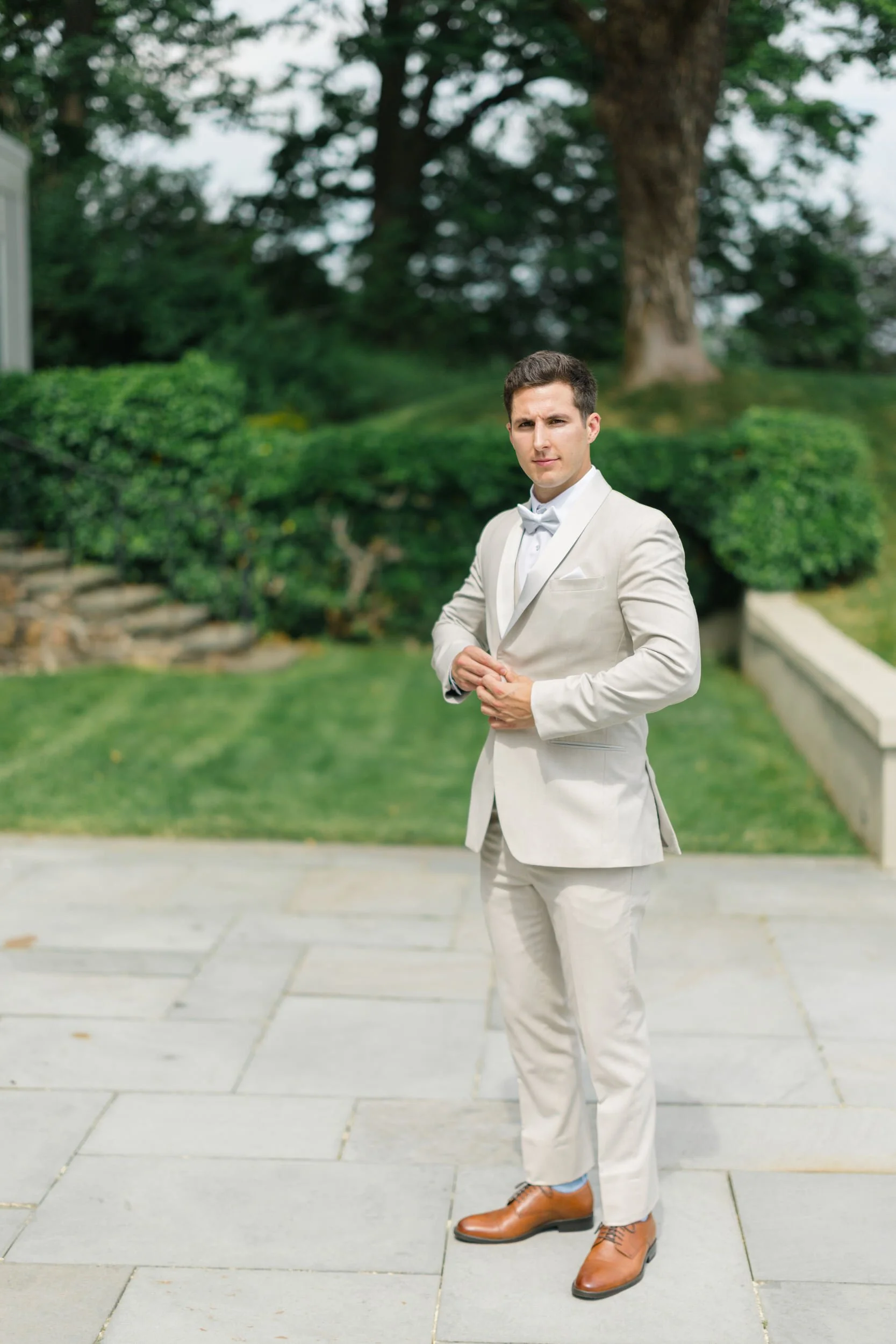 Classic groom solo portraits taken at Misselwood Estate on a sunny summer wedding day in Beverly, Massachusetts.