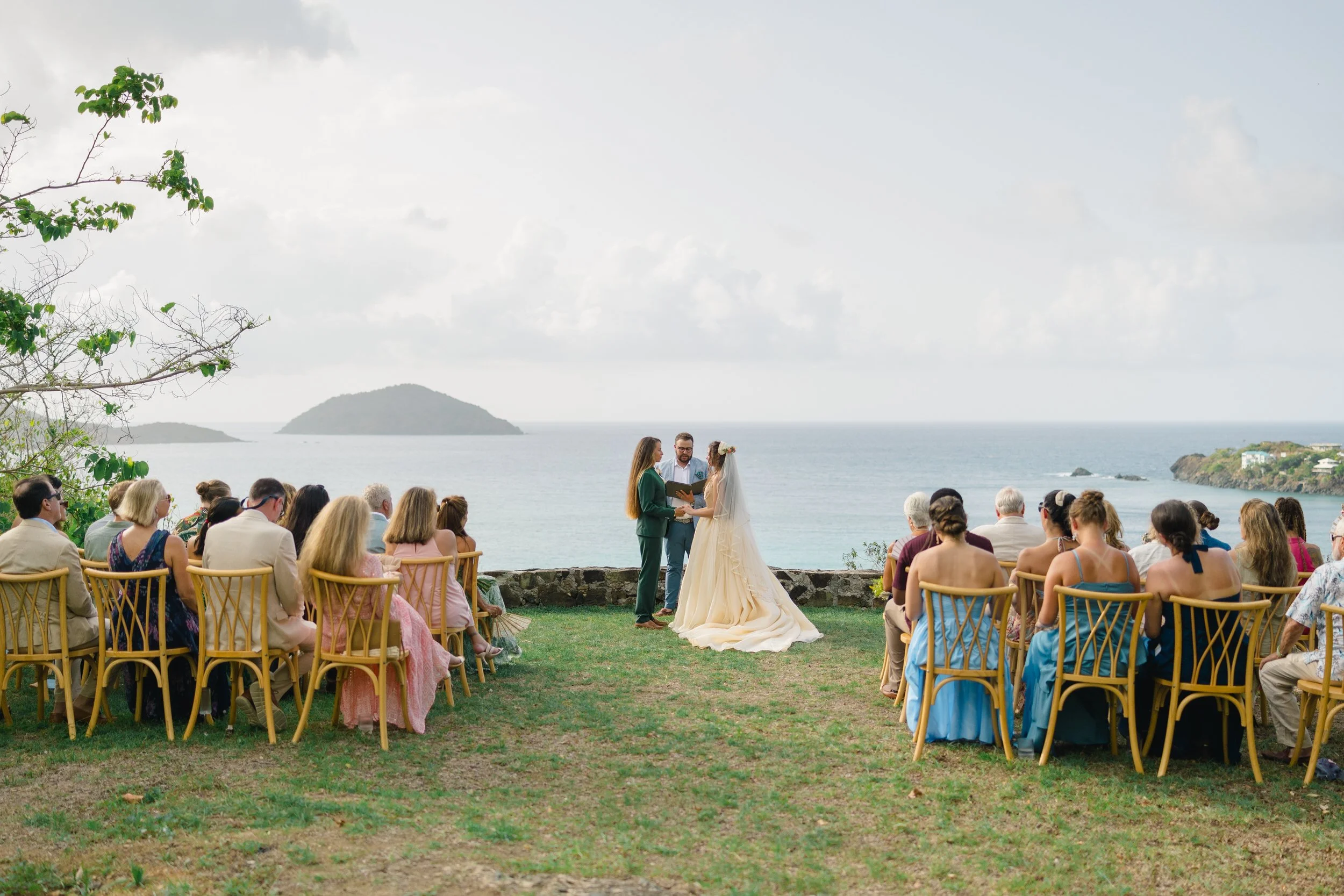 Two brides exchanging vows at The Hideaway at Hull Bay in St. Thomas.