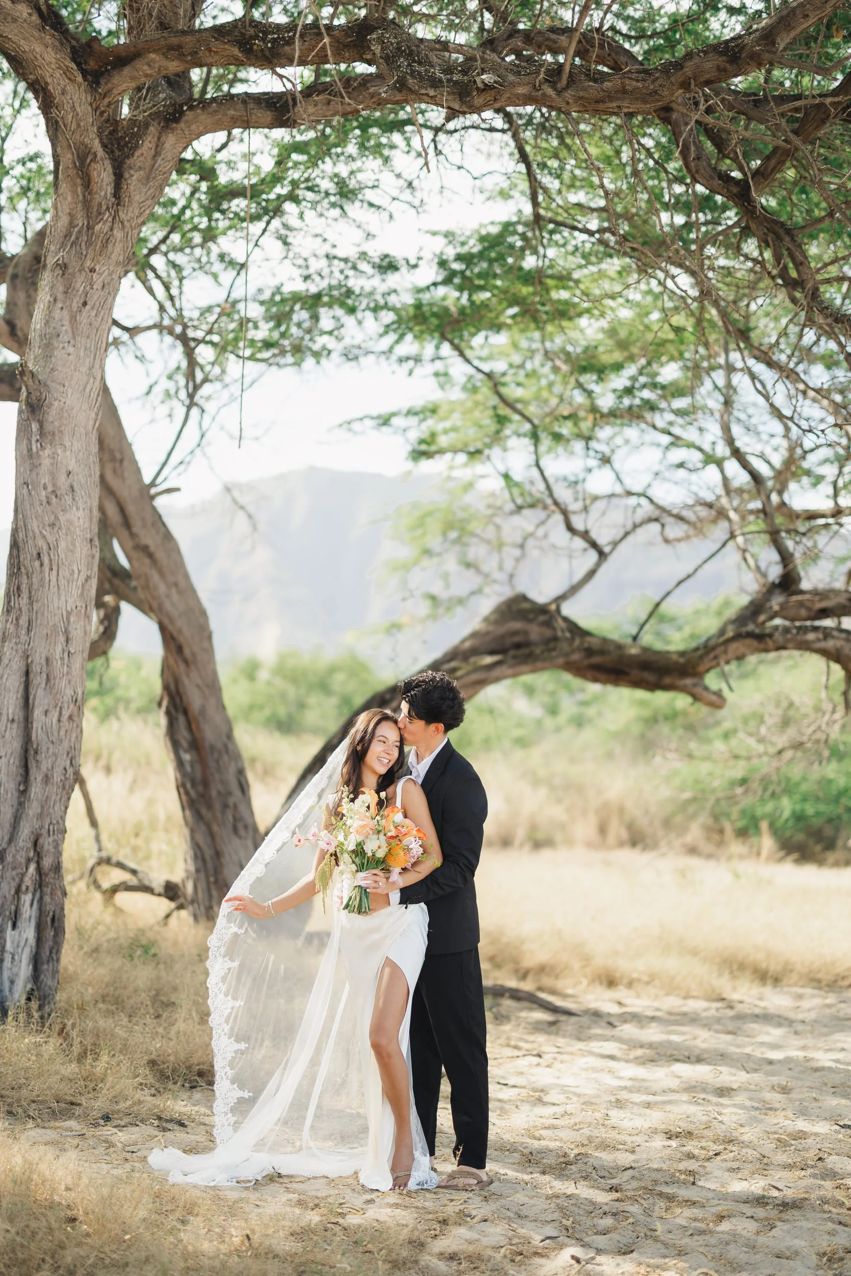 Oahu destination elopement couple sharing quiet moment by the ocean