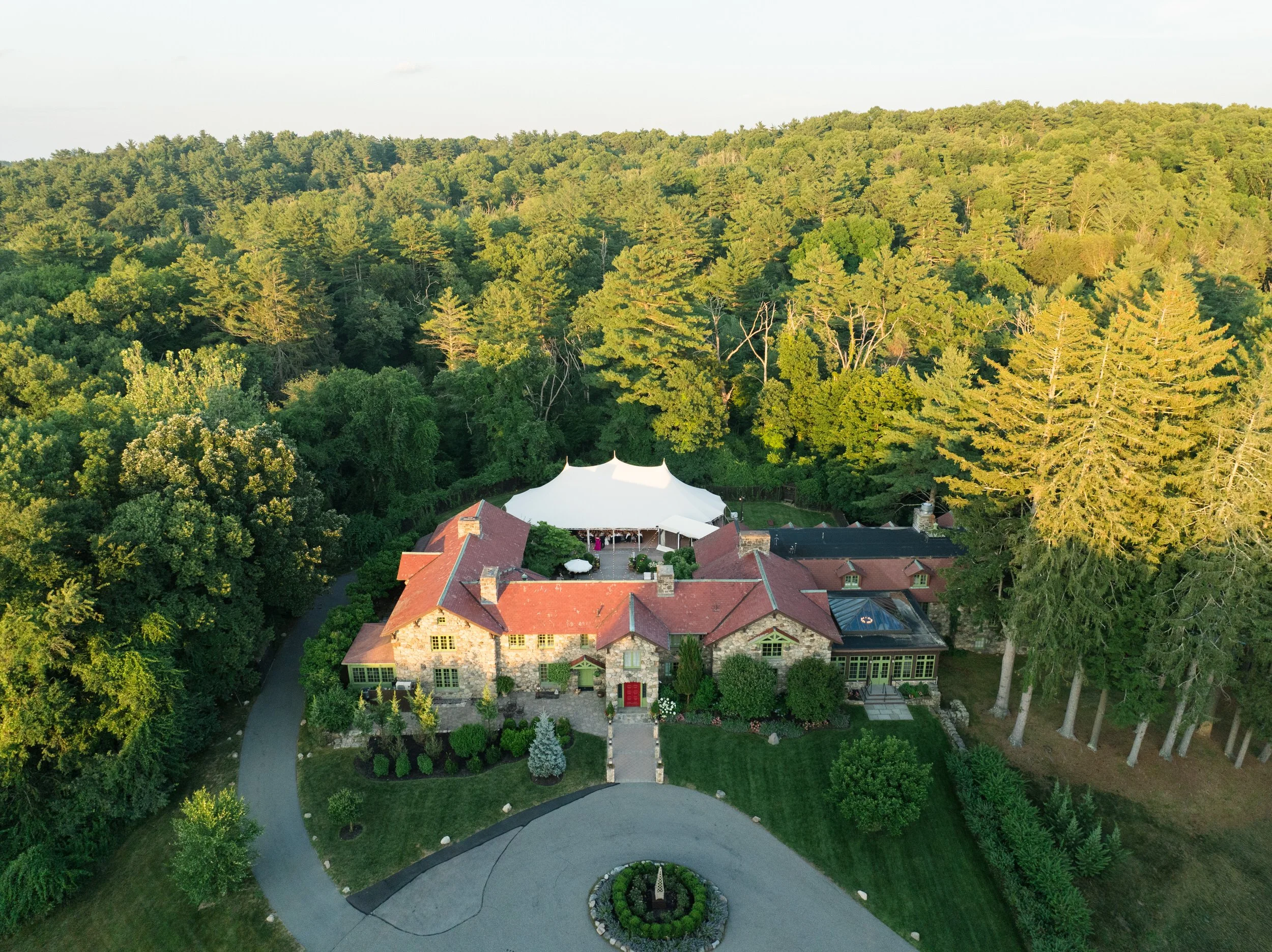 Outdoor estate setting at Willowdale Estate Massachusetts wedding venue on a bright summer day