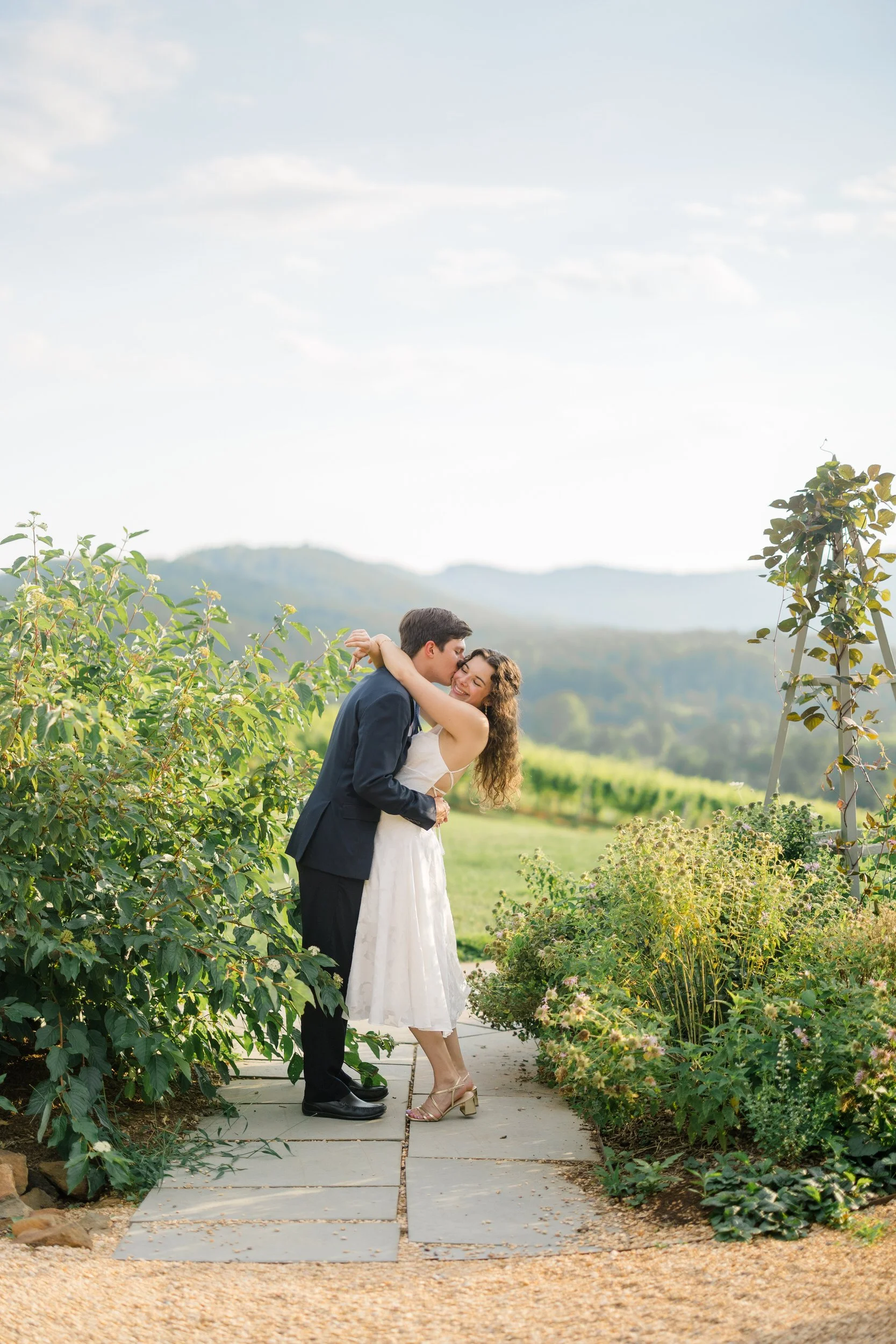 Engagement portraits of a couple overlooking the vineyard at Pippin Hill