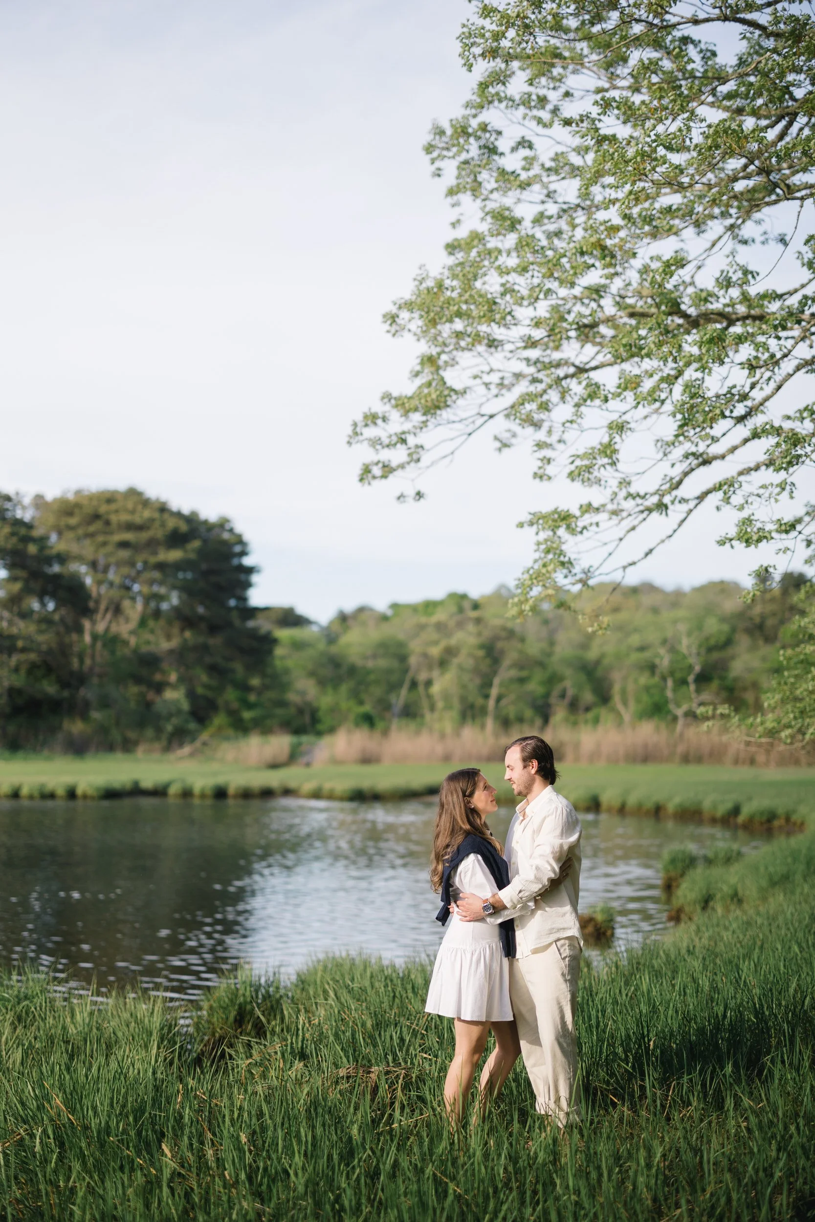 Chatham Cape Cod engagement session with couple standing in dune grass wearing Ralph Lauren inspired outfits.