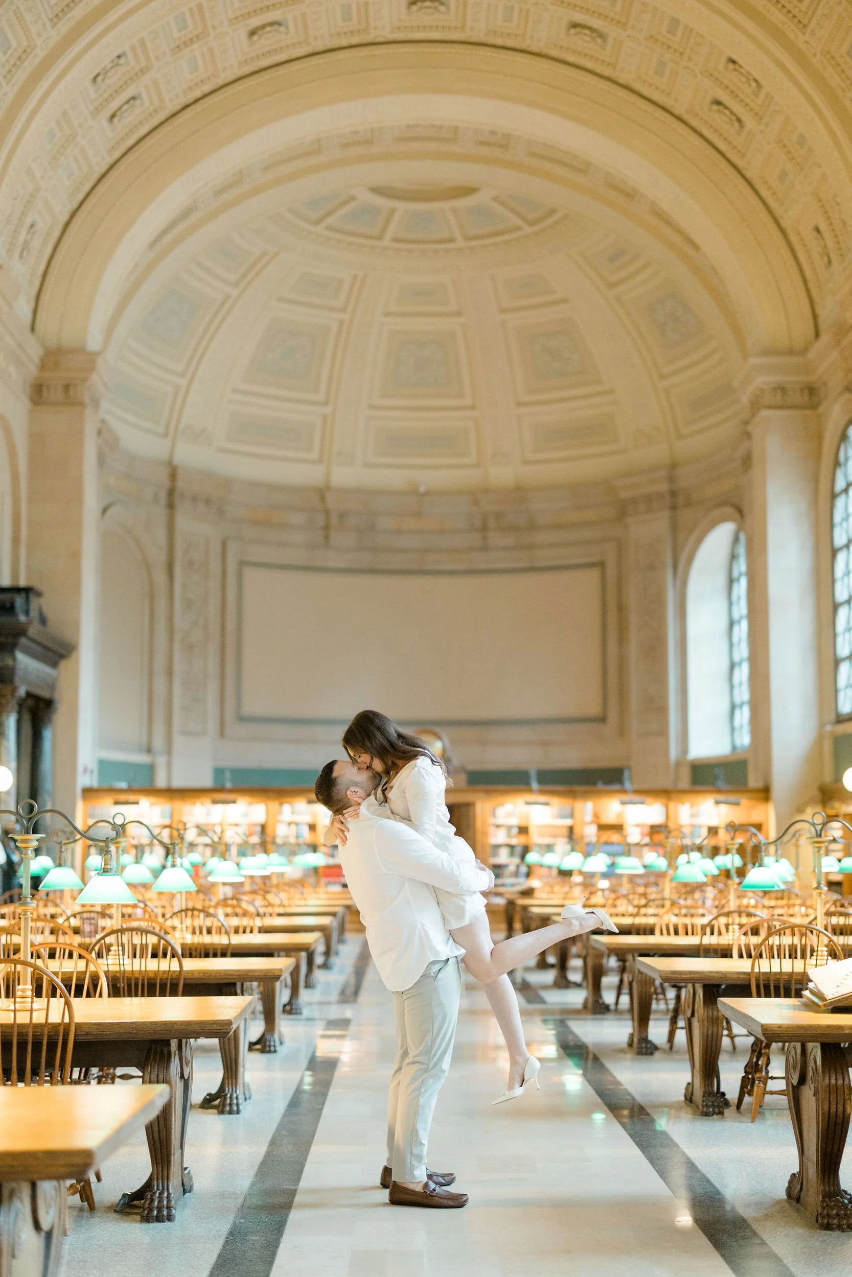 Engagement photos at the Boston Public Library showcasing classic architectural details