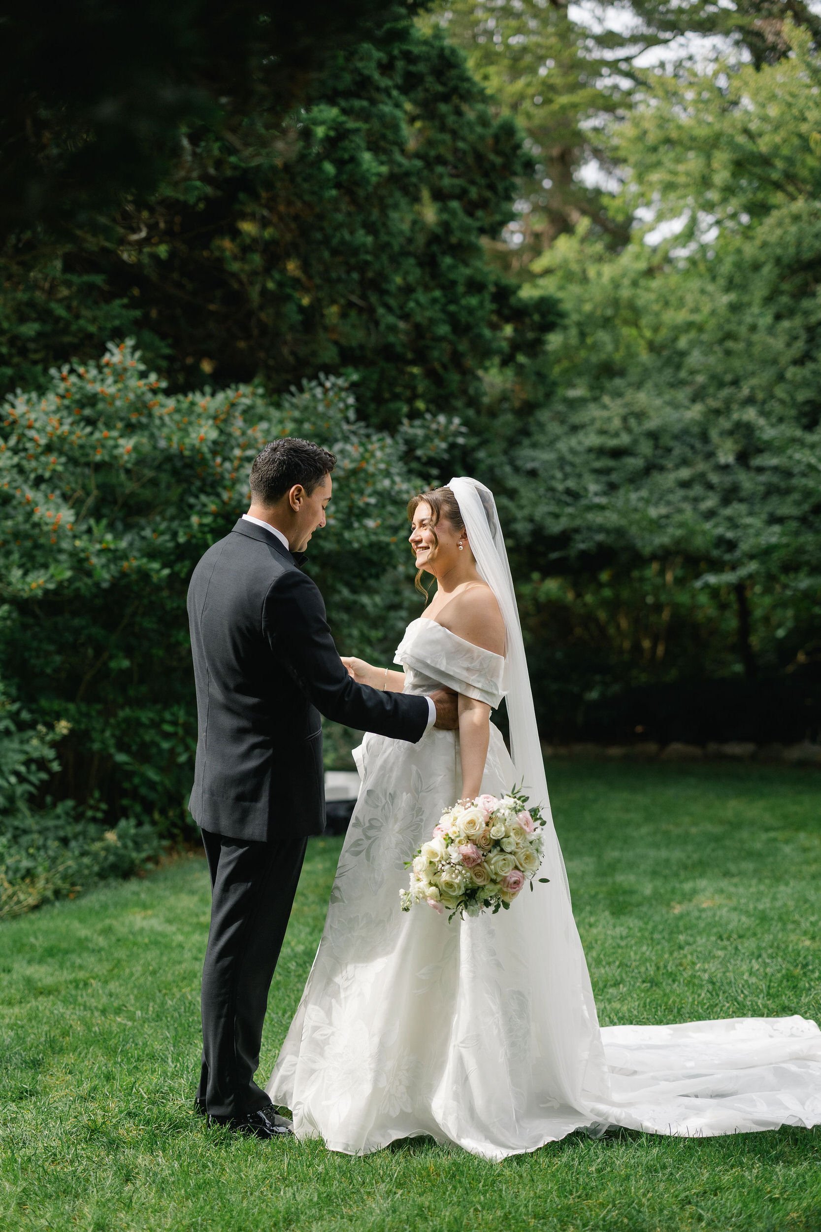 Couple seeing each other for the first time on their wedding day among the Long Hill gardens.