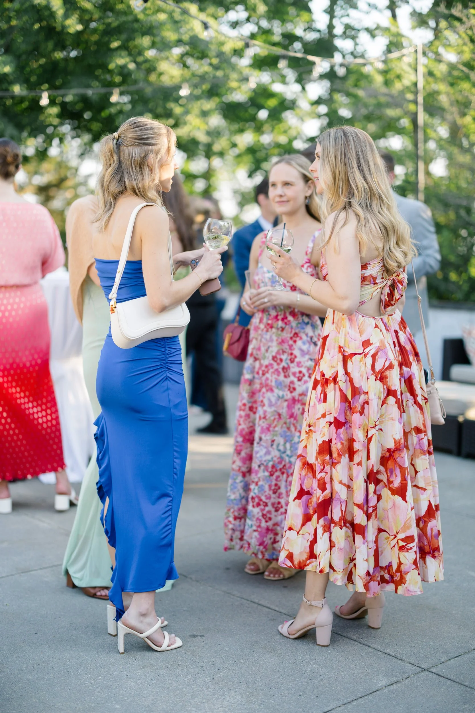 Guests mingling during outdoor cocktail hour overlooking the ocean.