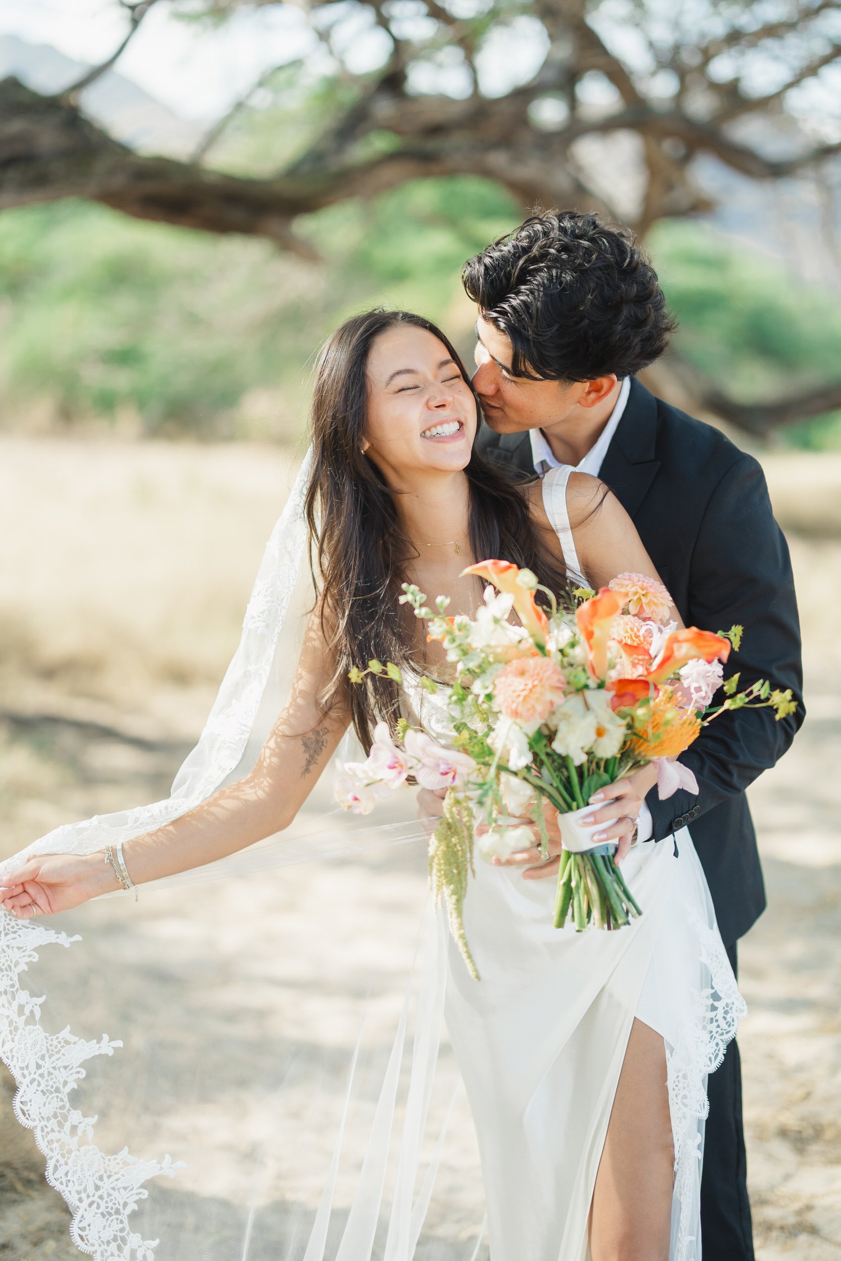 Oahu destination elopement couple sharing quiet moment by the ocean