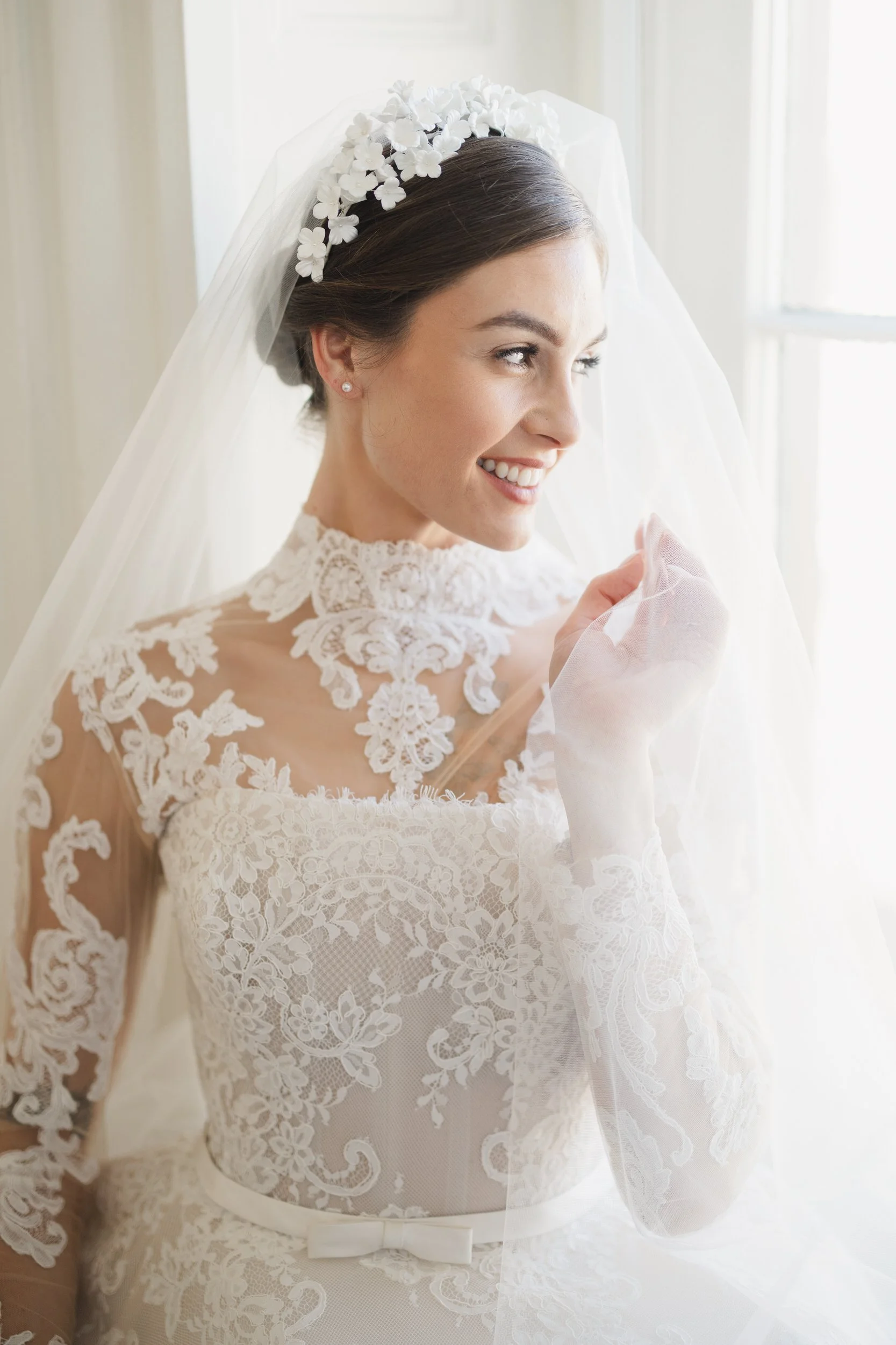 Bridal portrait with neutral florals and warm interior light at Brasserie La Banque in downtown Charleston, SC
