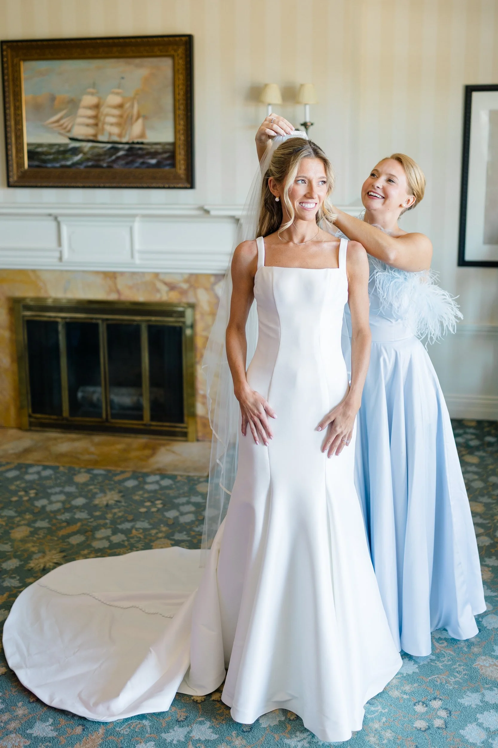 Bride putting on her wedding dress at Ocean Edge Resort