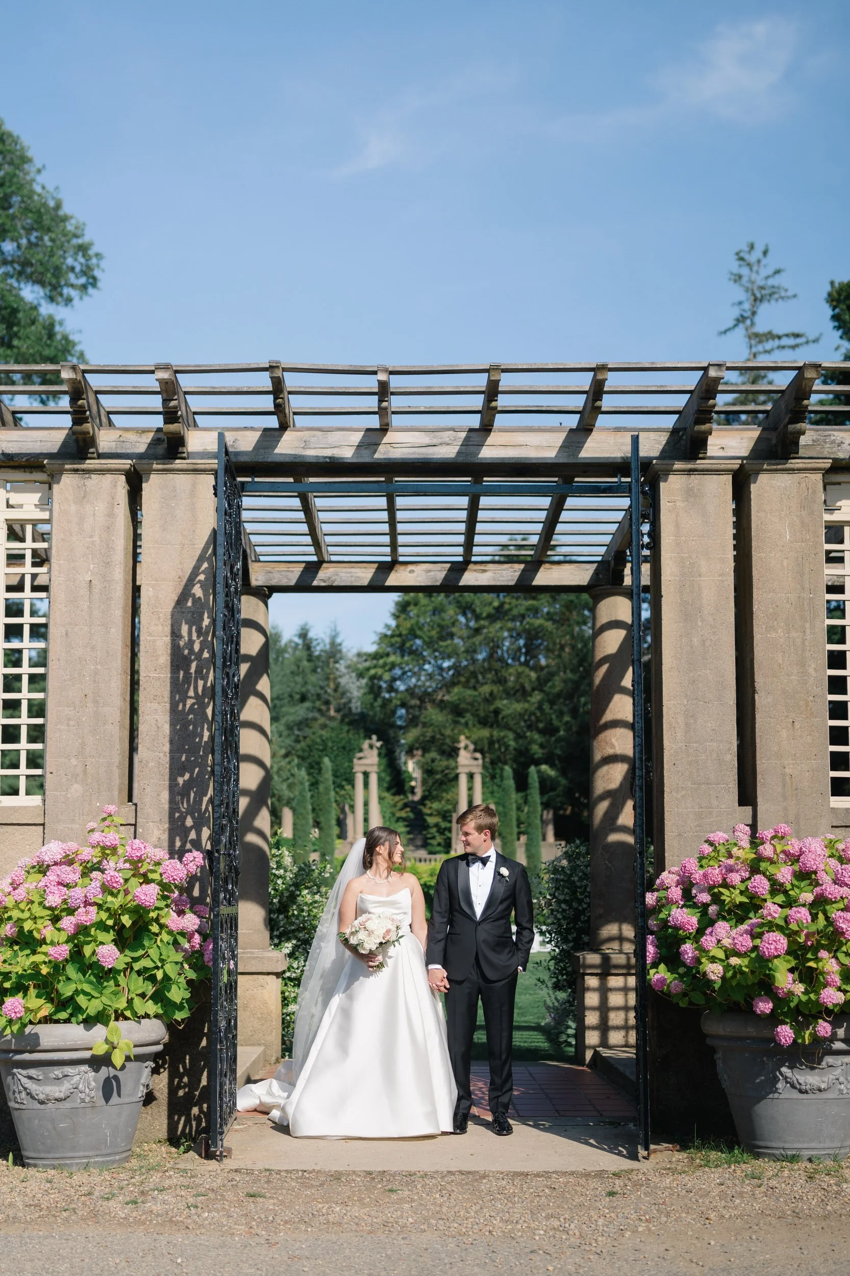 Romantic portrait session of the couple framed by historic architecture at Castle Hill on the Crane Estate.