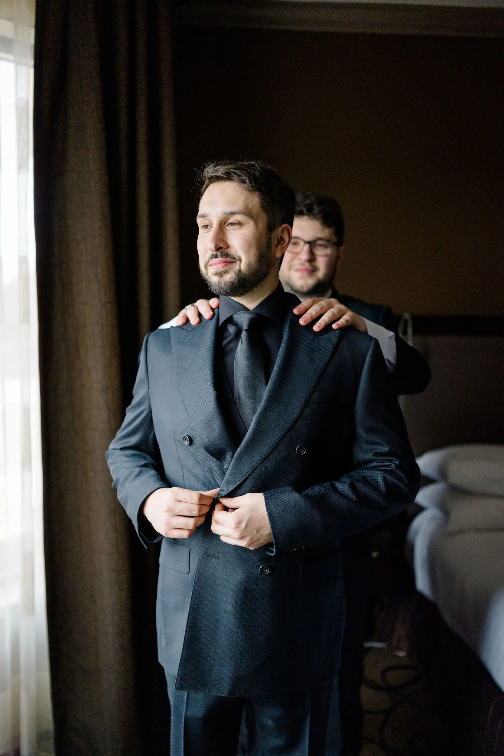 Groom preparing for a secret garden inspired wedding in Massachusetts.