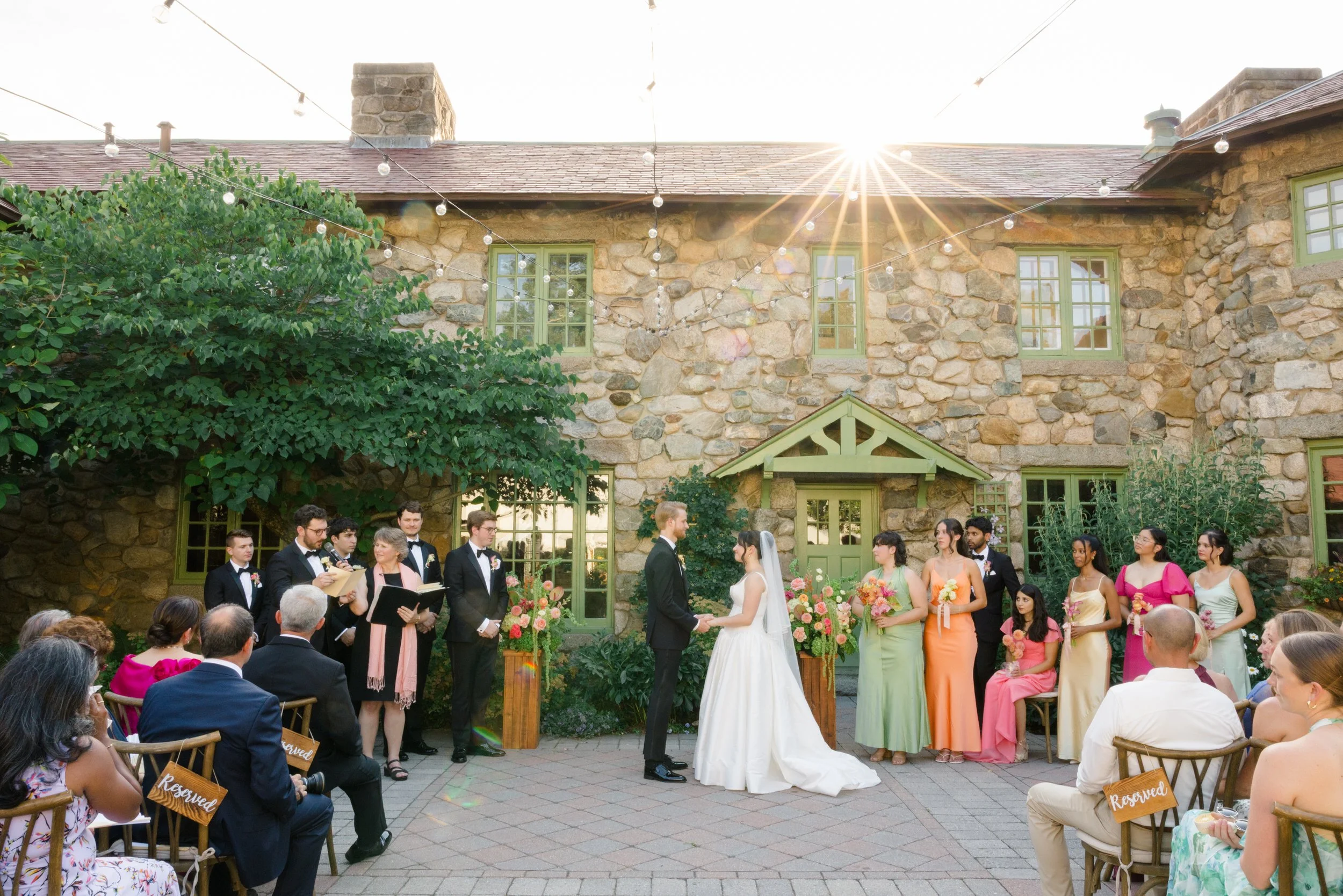 Bride and groom exchanging vows at outdoor ceremony at Willowdale Estate Massachusetts