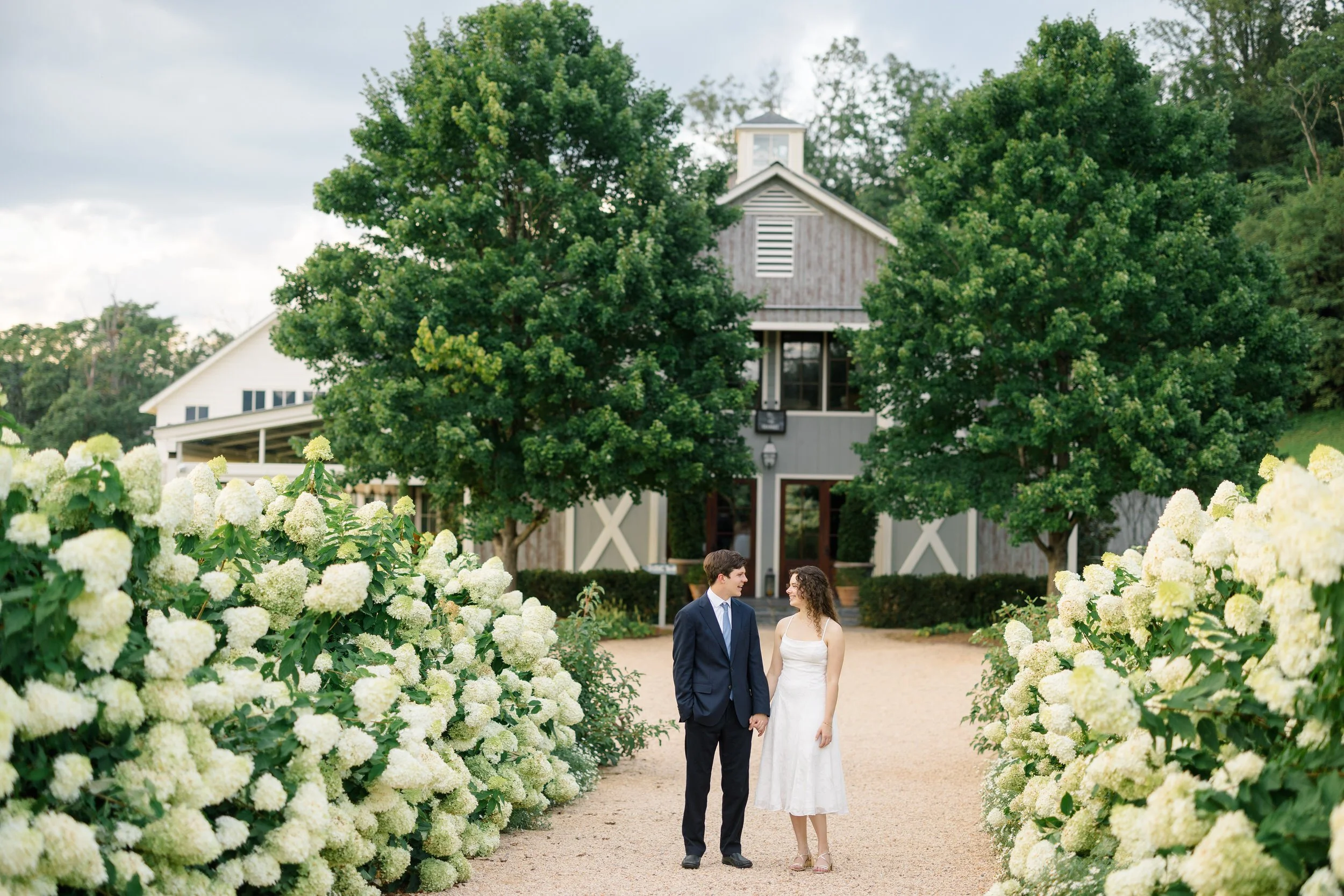 Couple standing together against the rolling Virginia wine country landscape