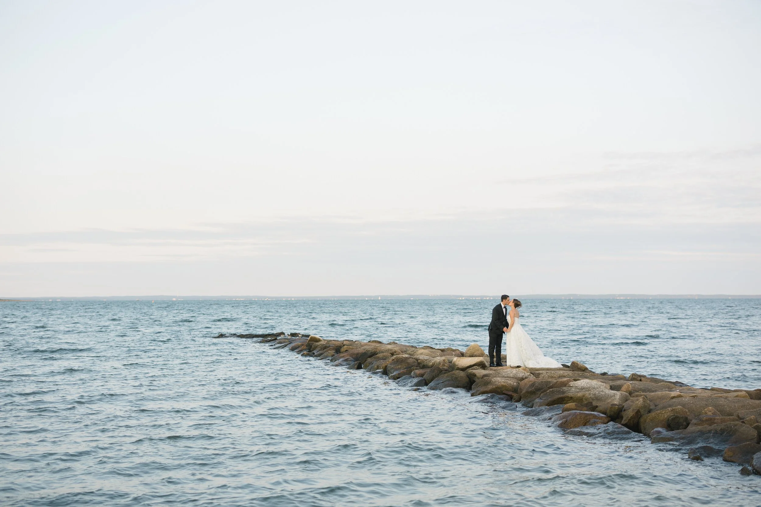 Sunset portraits overlooking the water during a Cape Cod private estate wedding.