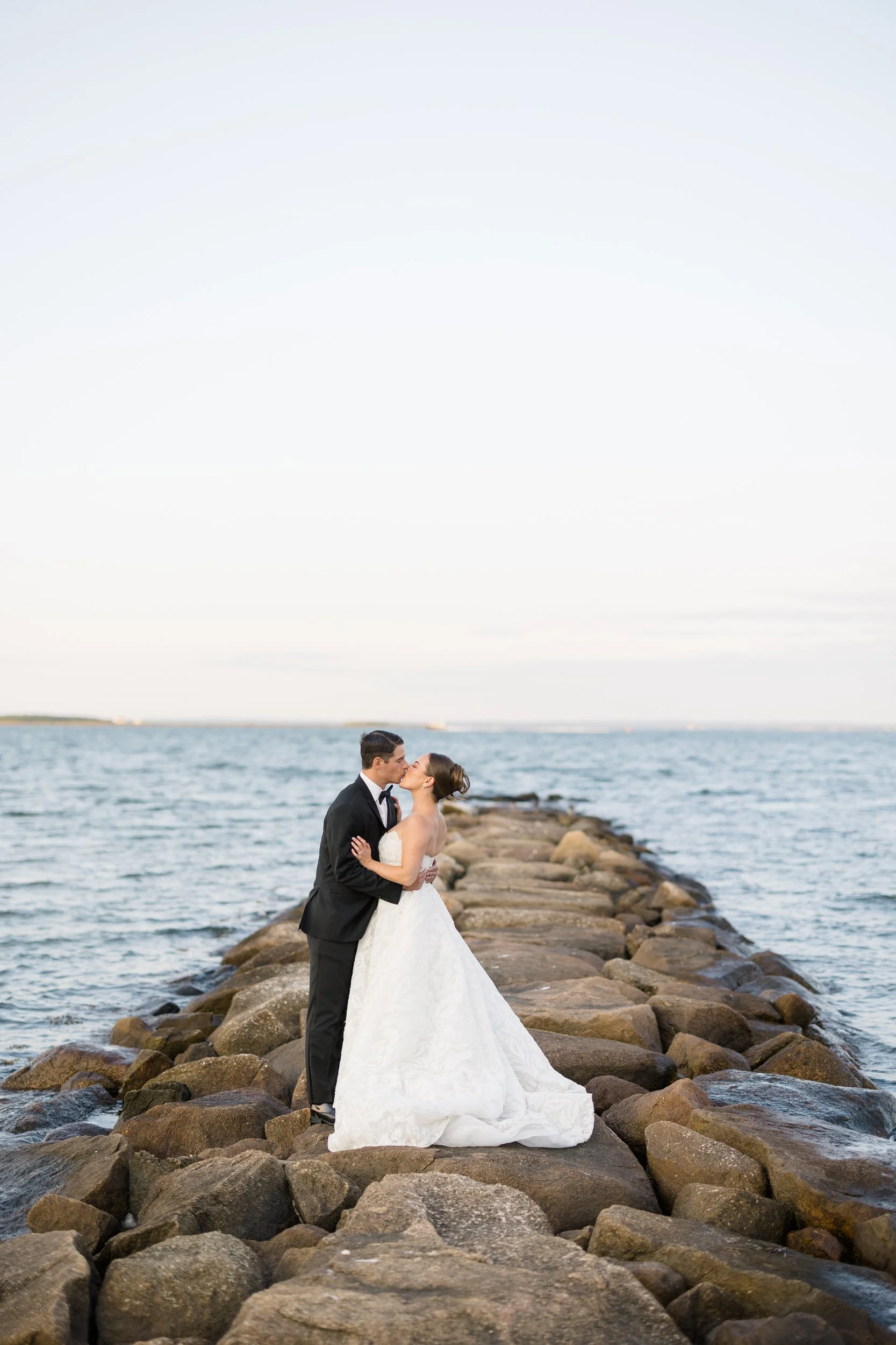Sunset portraits overlooking the water during a Cape Cod private estate wedding.