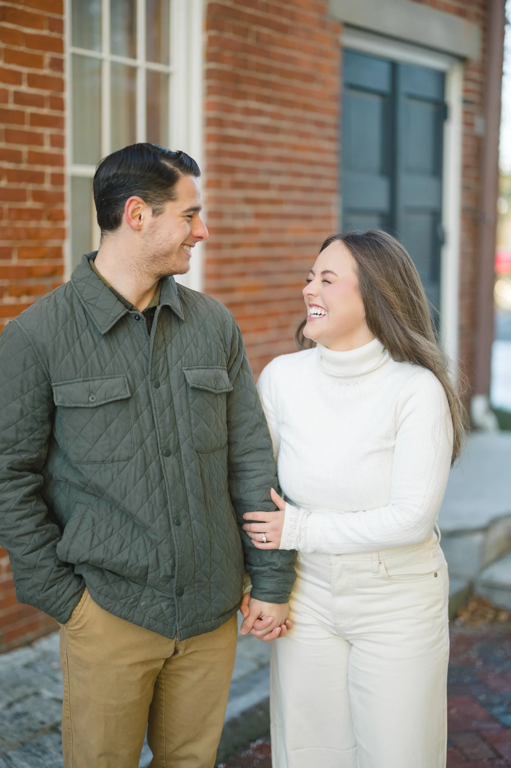 Couple walking together during a winter Newburyport engagement session.