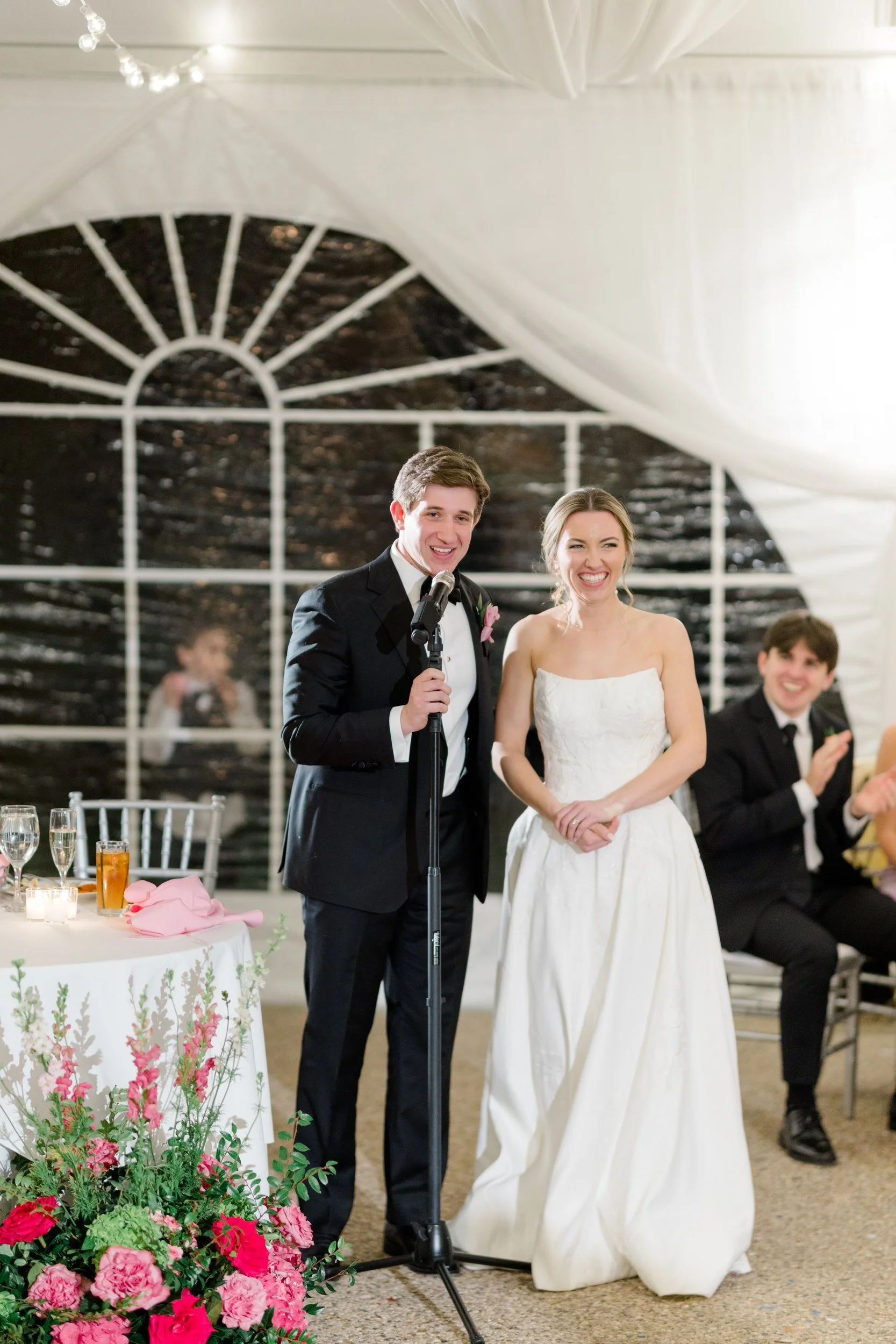 Luxury wedding reception with pink and green floral decor