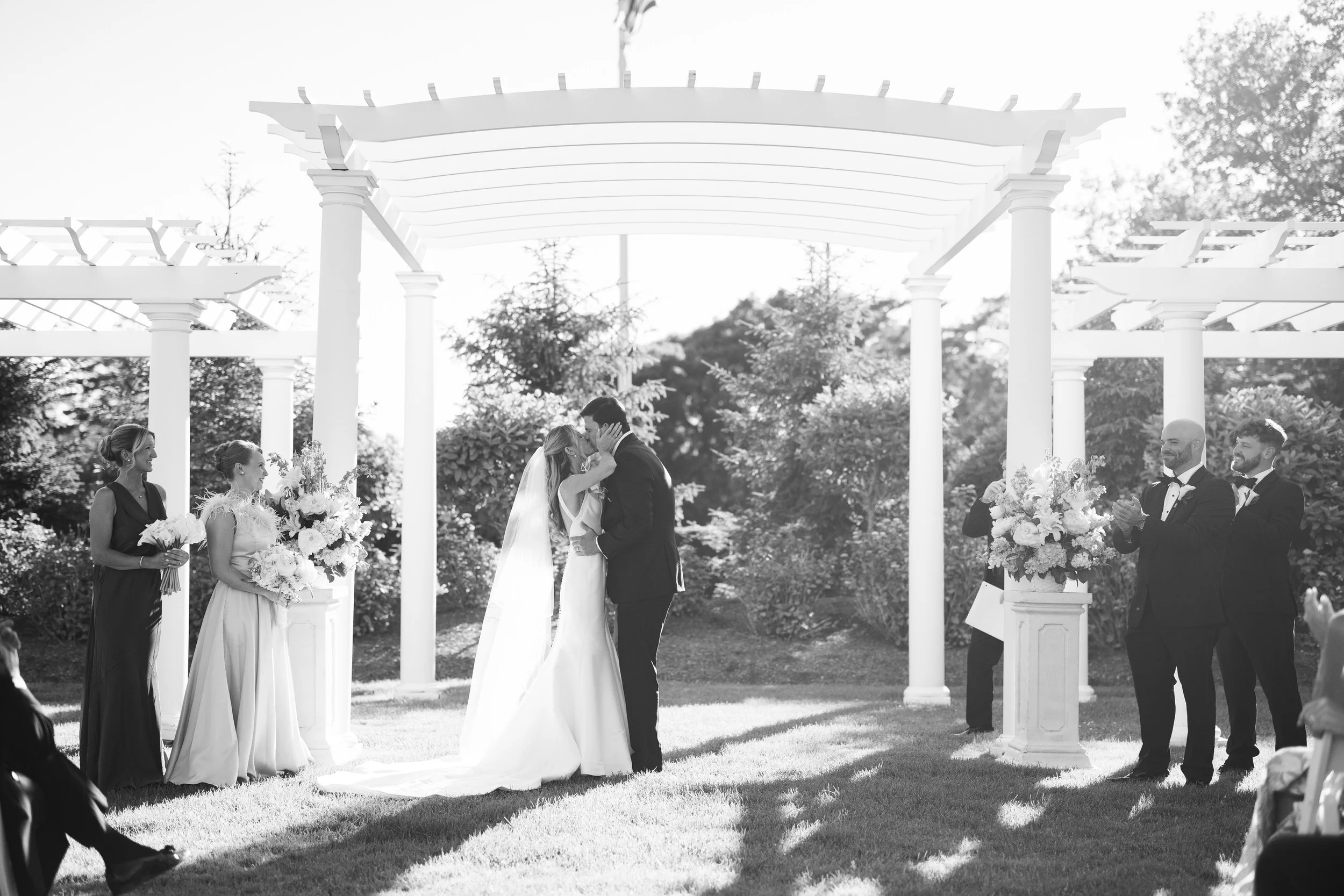 First kiss during a Cape Cod wedding ceremony