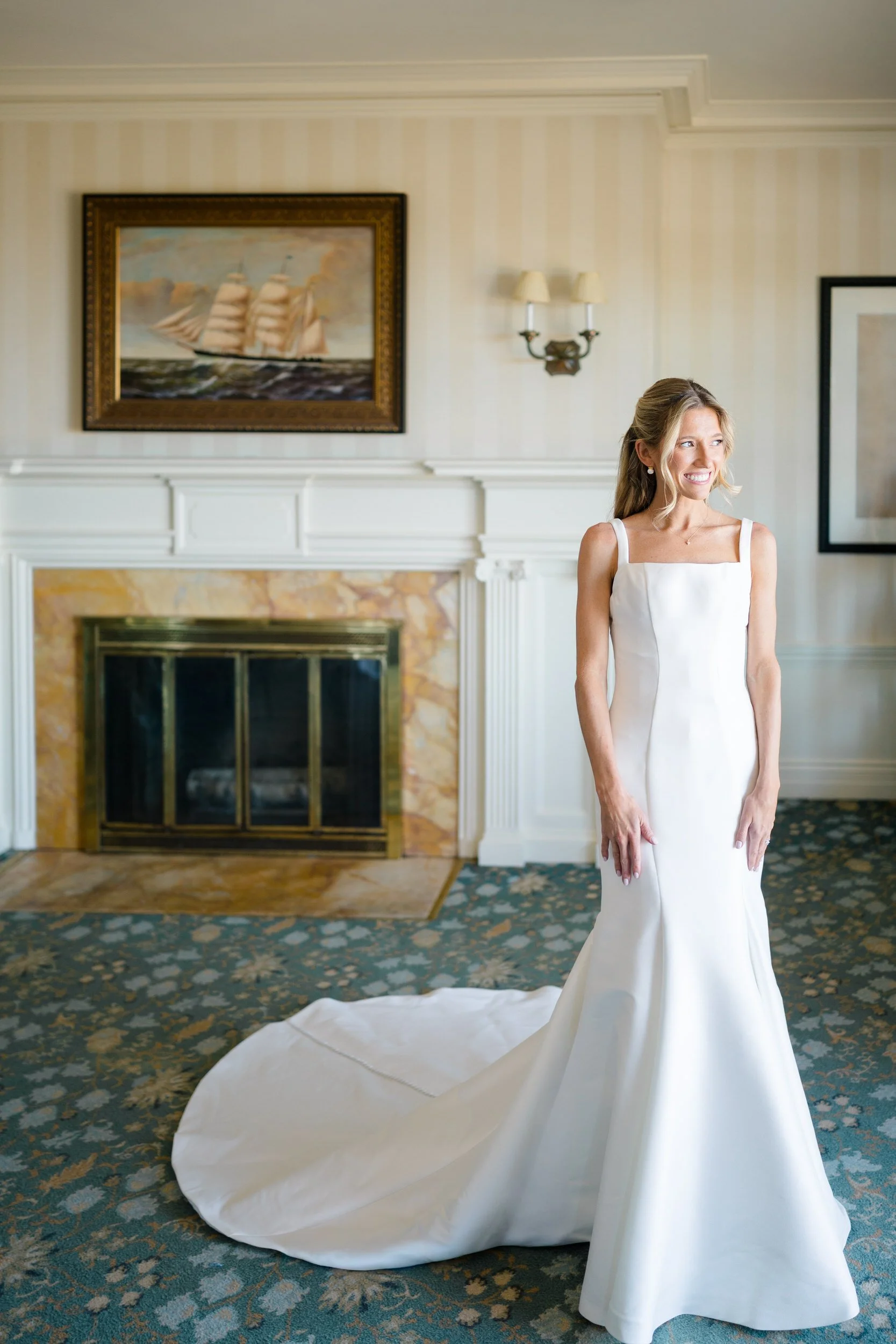 Bride putting on her wedding dress at Ocean Edge Resort