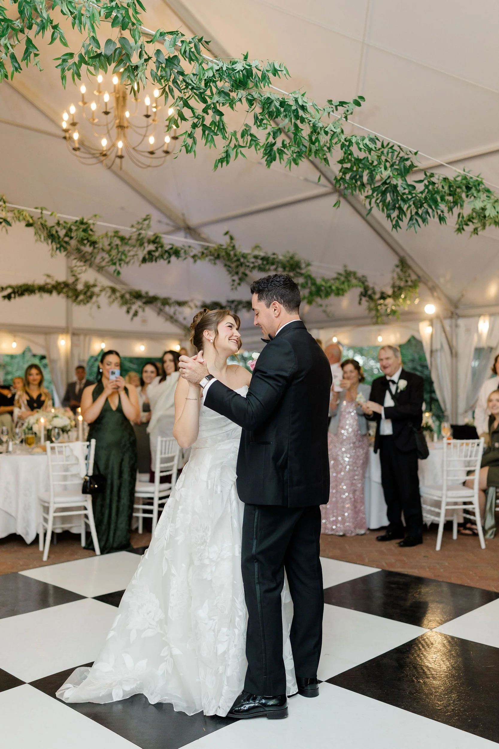 Newlyweds sharing their first dance at the Long Hill estate wedding reception.