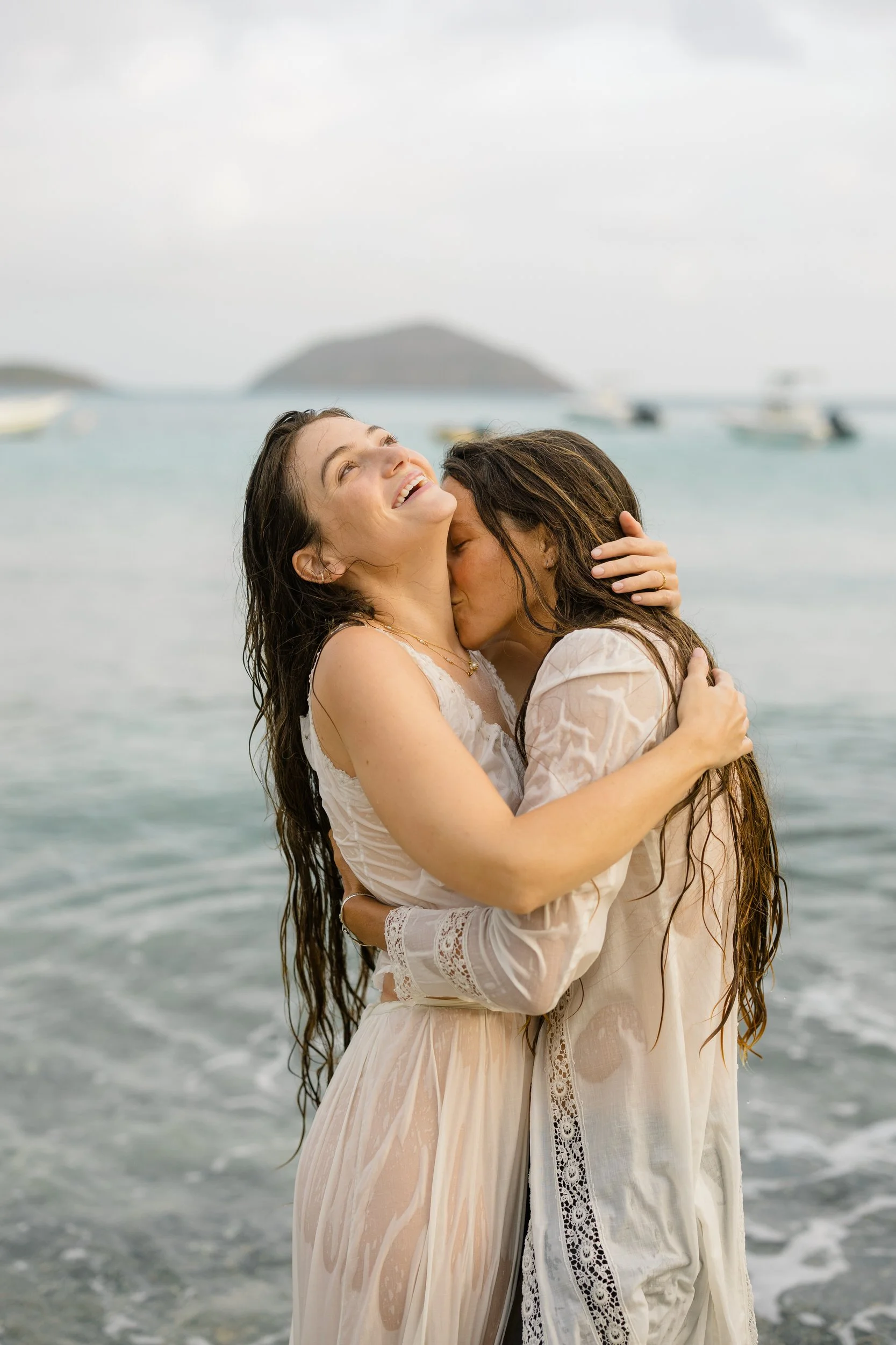 Queer newlywed portraits in the ocean in St. Thomas.