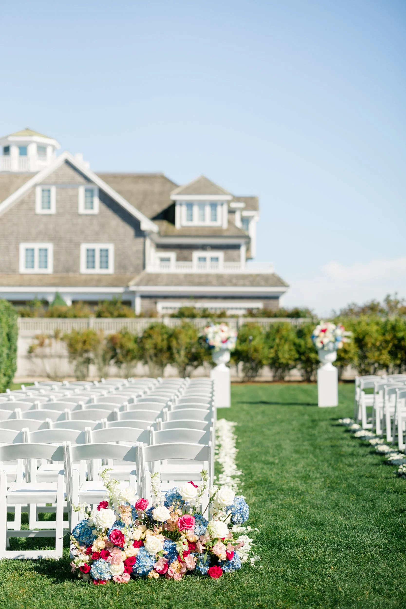 Wedding ceremony seating arranged on the Dune lawn at Wychmere Beach Club.
