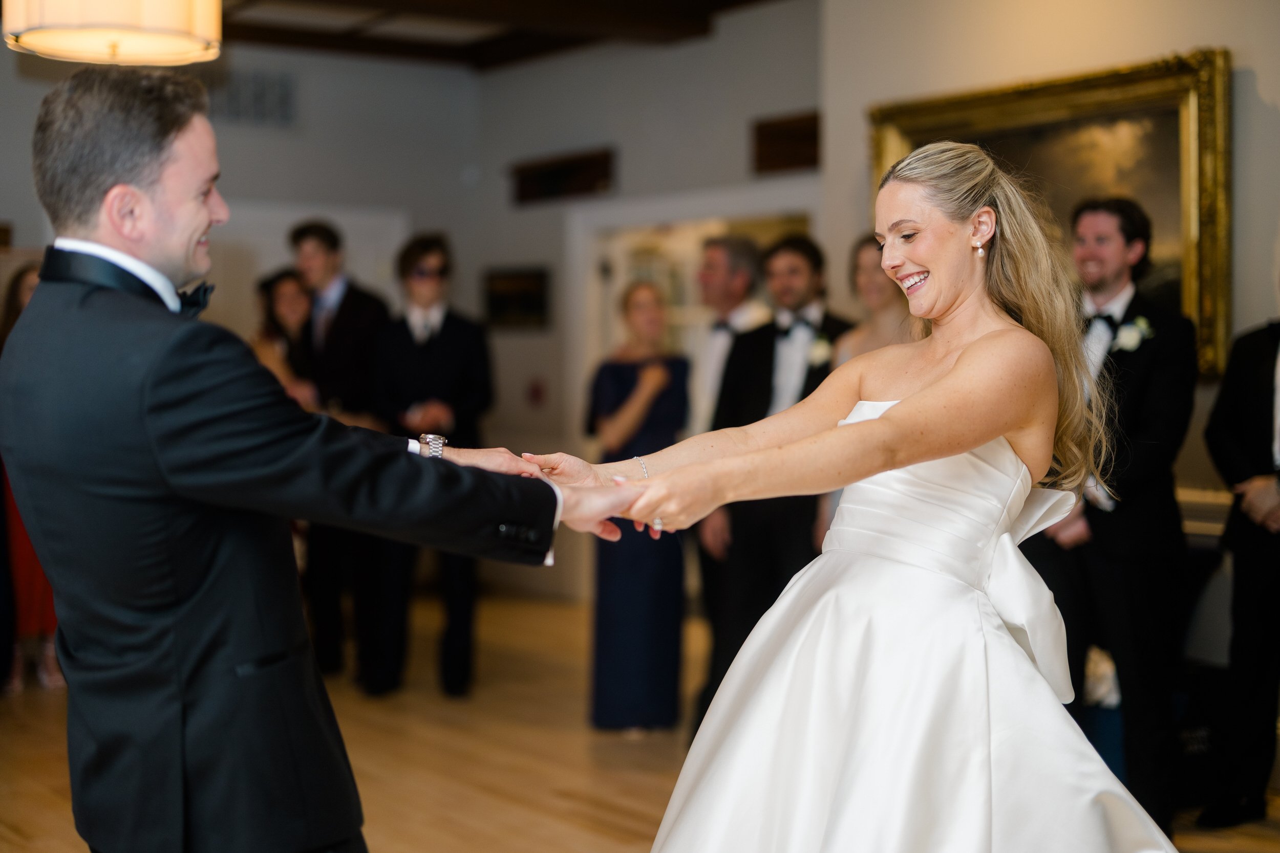 Wedding reception at Corinthian Yacht Club overlooking Marblehead Harbor with dancing and celebration.