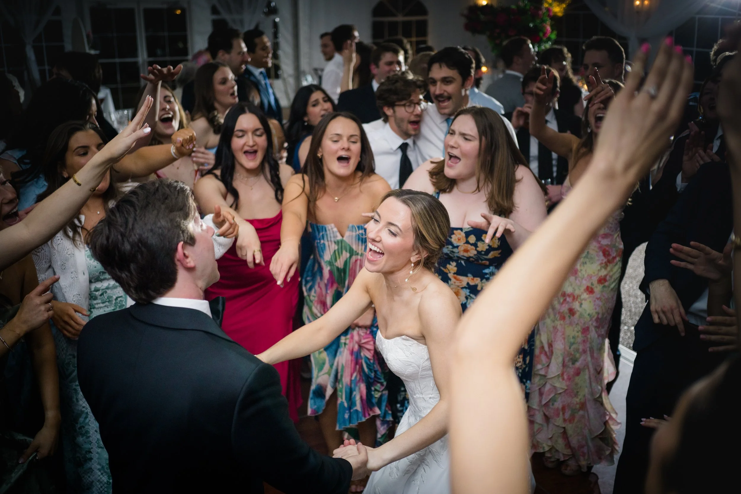 Joyful candid dancing moments at coastal New England wedding