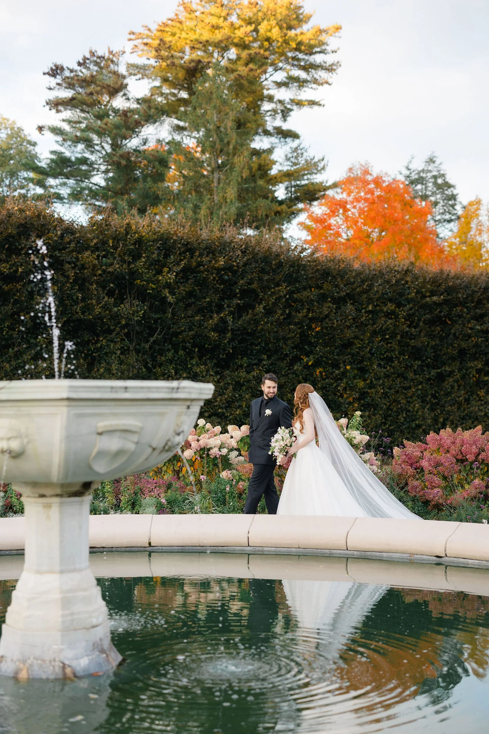 Bride and groom photographed together during their romantic Elm Bank wedding.