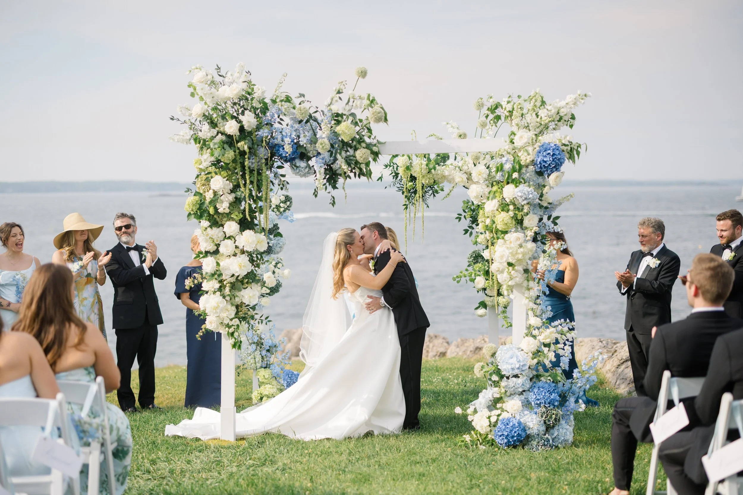 A Marblehead wedding ceremony overlooking hundreds of sailboats at a Corinthian Yacht Club celebration.