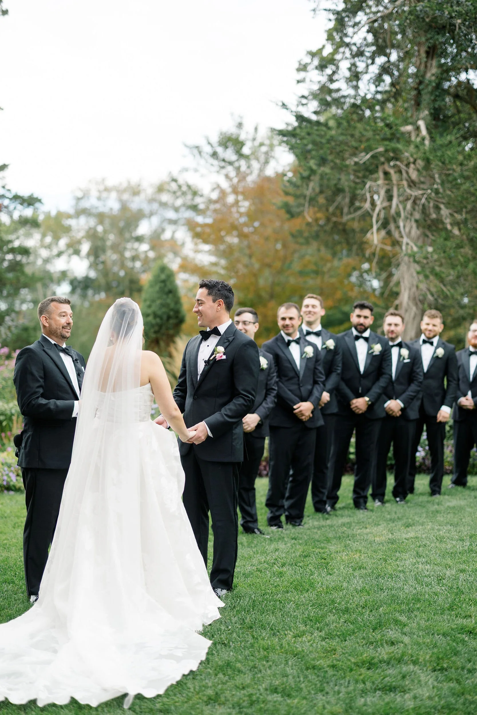 Wedding couple standing together during their outdoor ceremony at Long Hill.