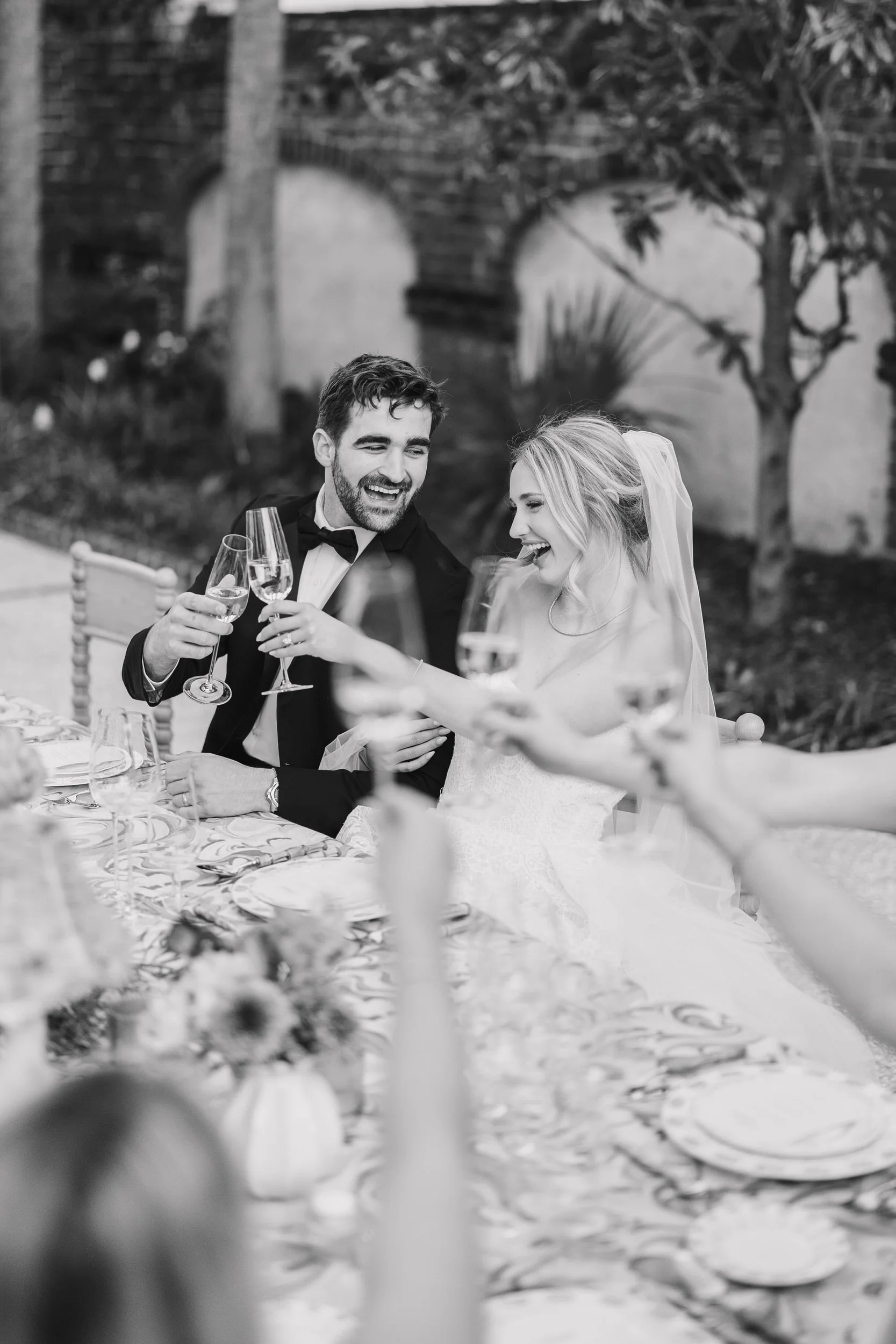 Couple enjoying their first dance surrounded by colorful spring wedding décor in Charleston, SC.