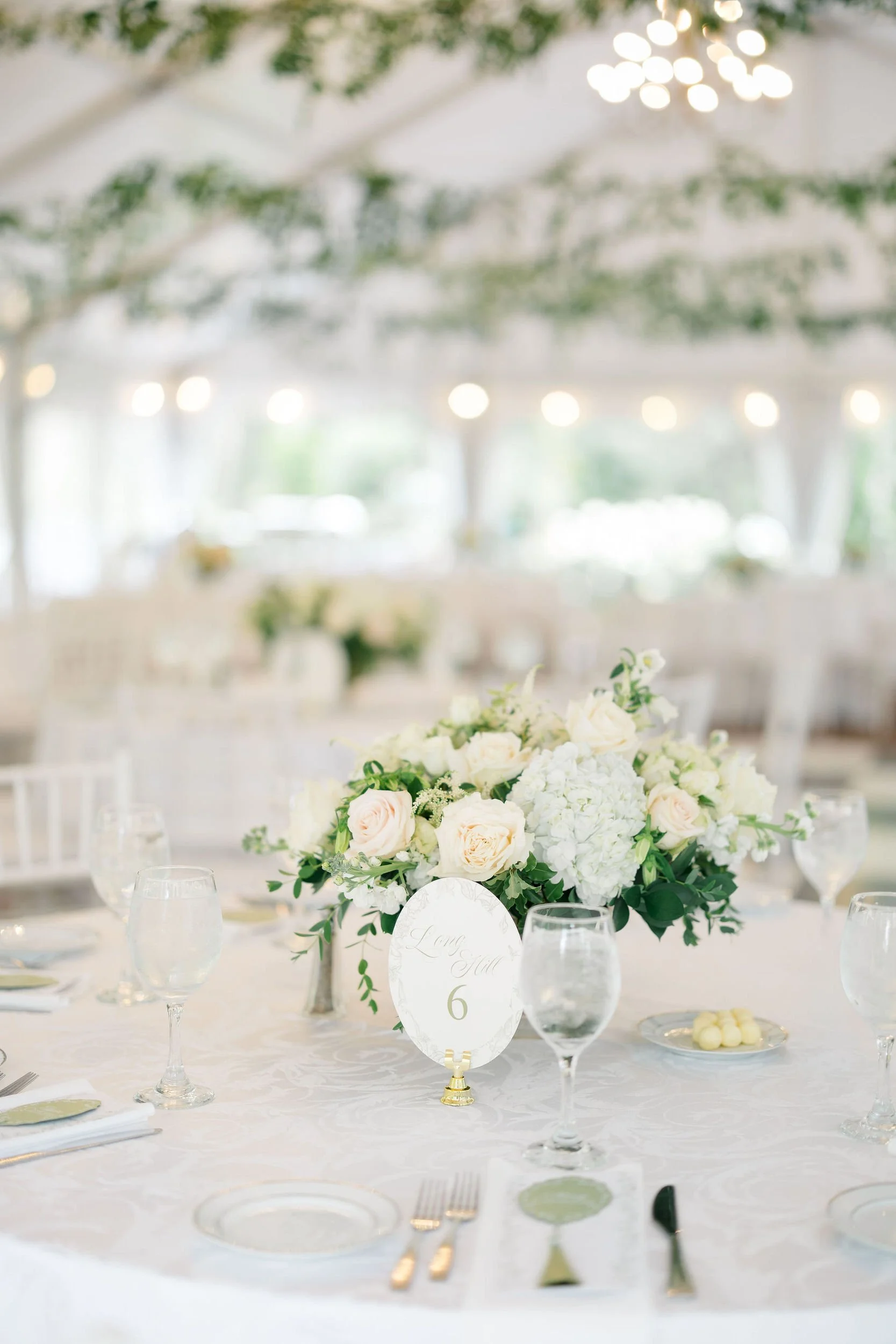Wedding table settings and floral arrangements at the Long Hill estate.