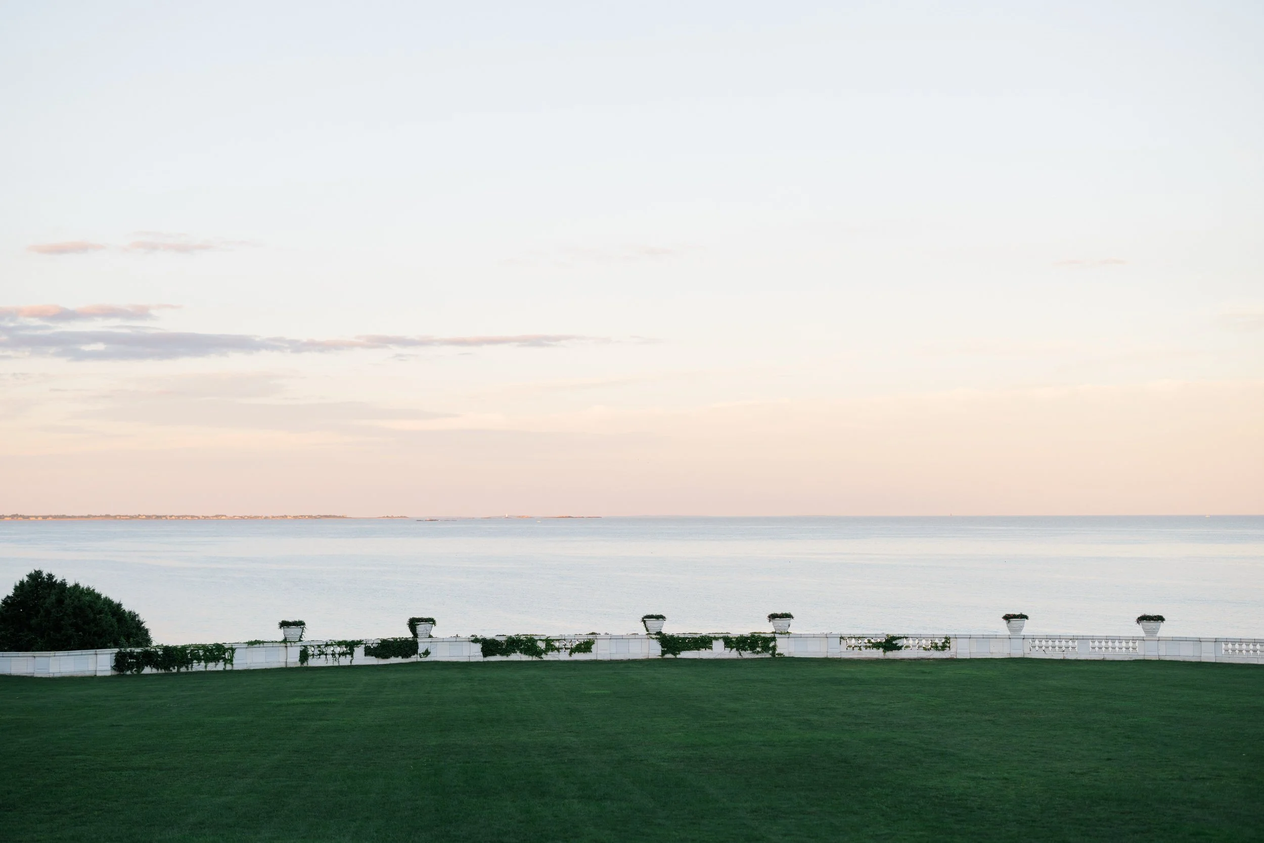 Aerial-style scenic view of Newport Mansions and ocean coastline