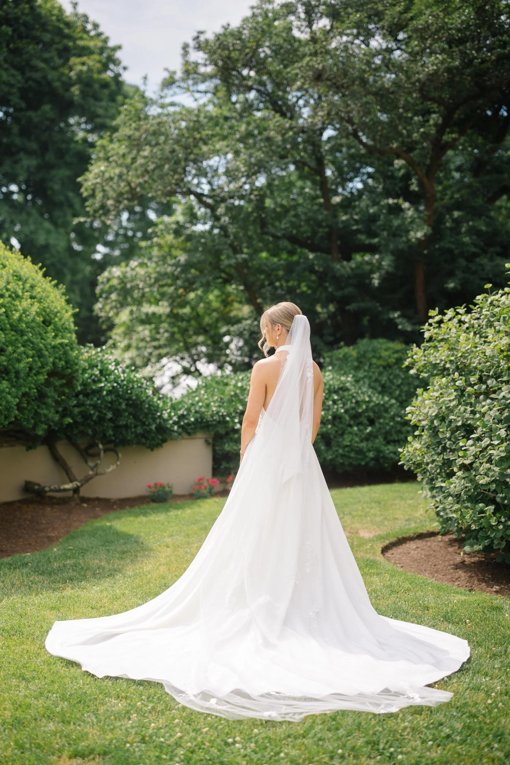 Elegant bridal portraits of the bride at Misselwood Estate on a sunny summer wedding day in Beverly, Massachusetts.