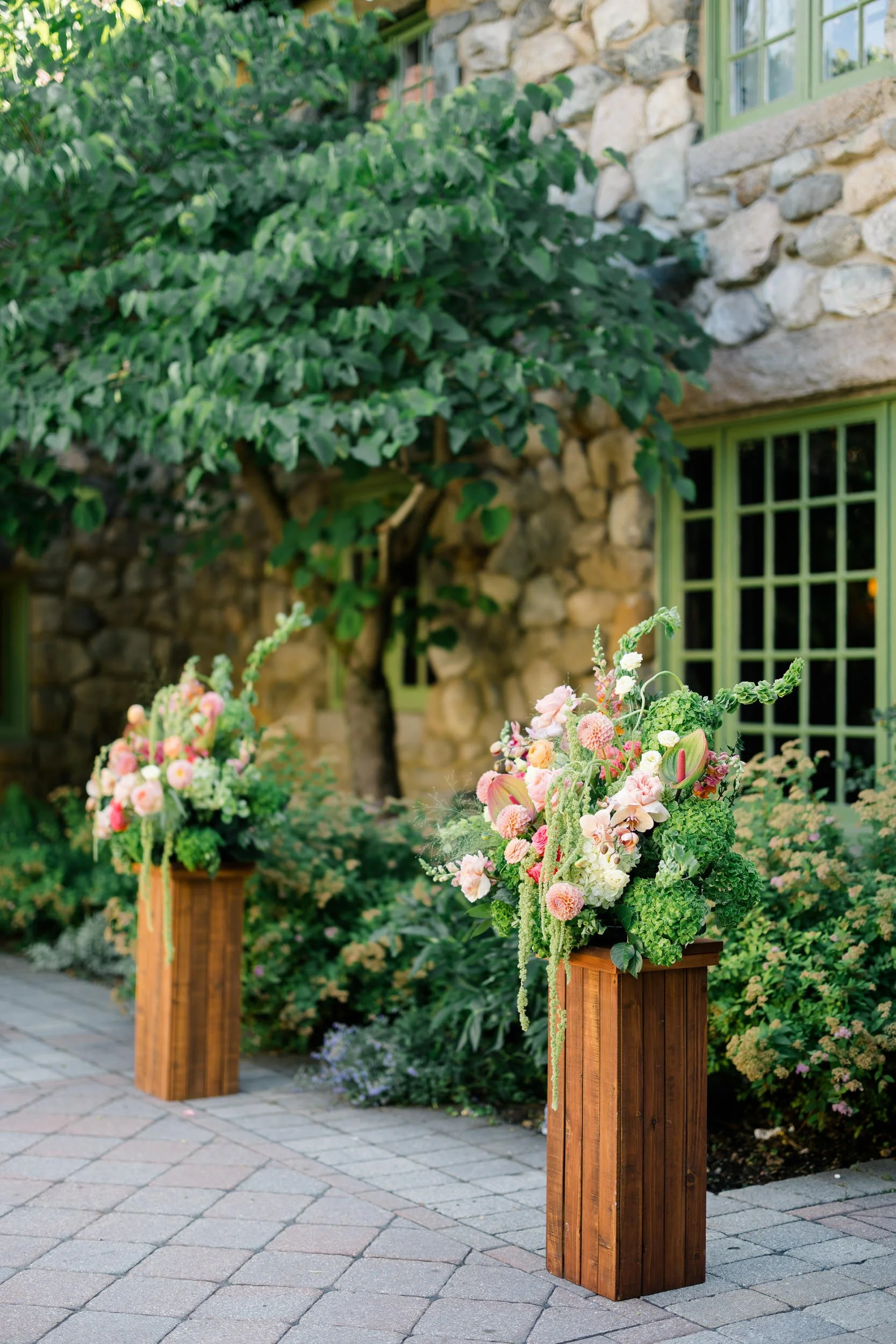 Wedding ceremony details showcasing lush pink orange and green floral palette at Willowdale Estate