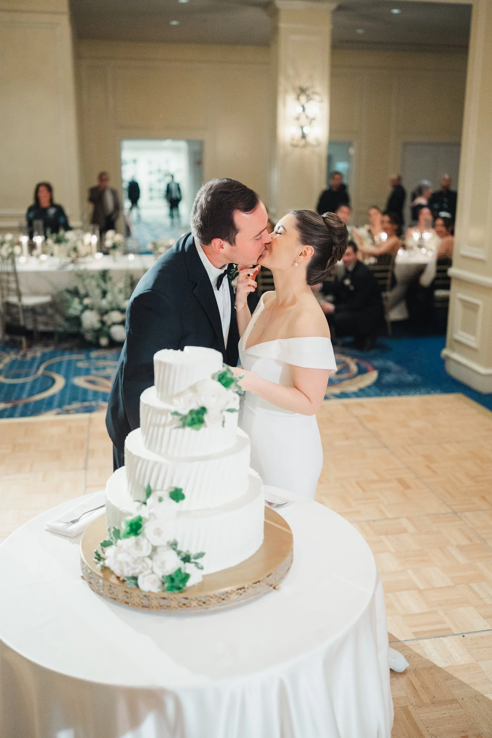 Classic wedding cake cutting at the Boston Harbor Hotel