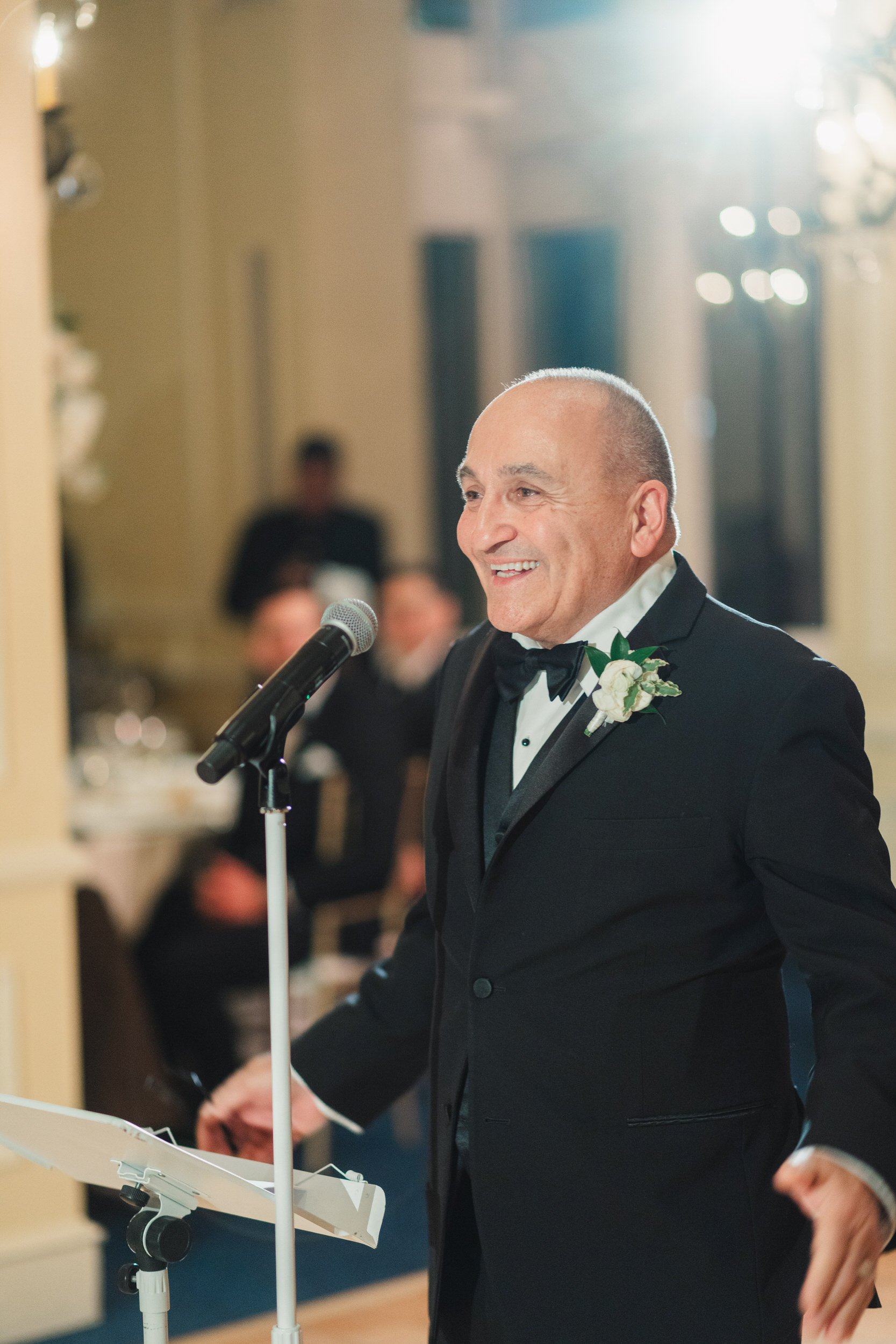Emotional wedding speeches during a Boston Harbor Hotel reception