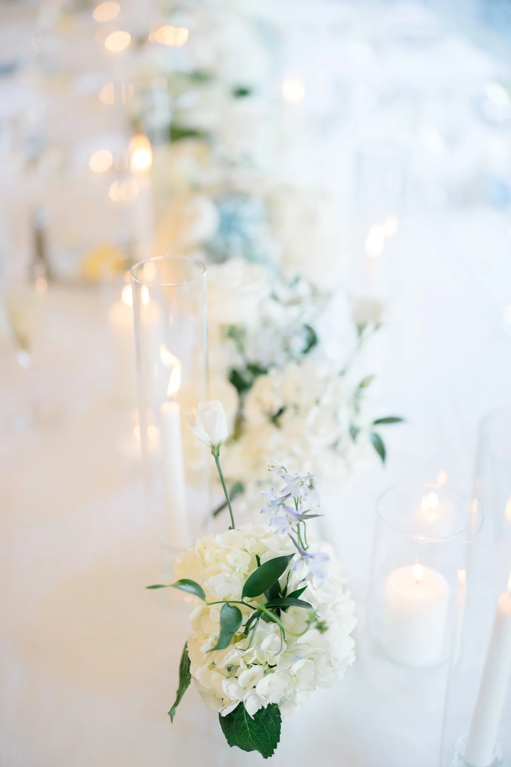Romantic reception styling for a waterfront wedding celebration.