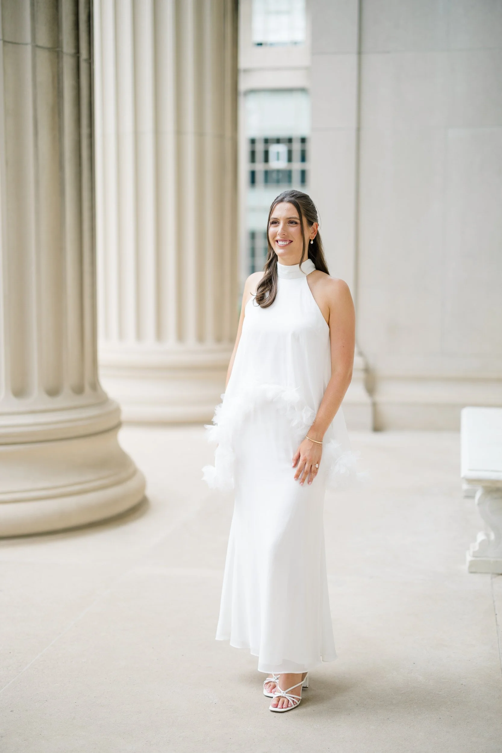 Bride wearing a modern tiered white gown during a timeless Boston engagement session.