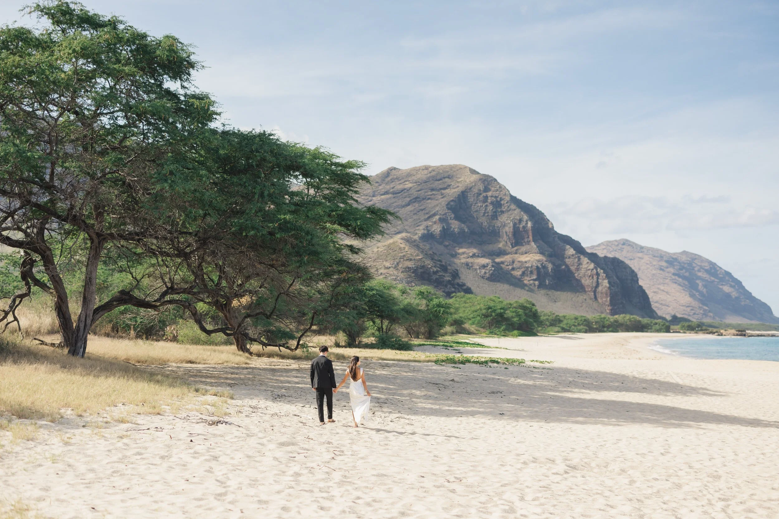 Couple portraits during sunrise beach elopement in Oahu
